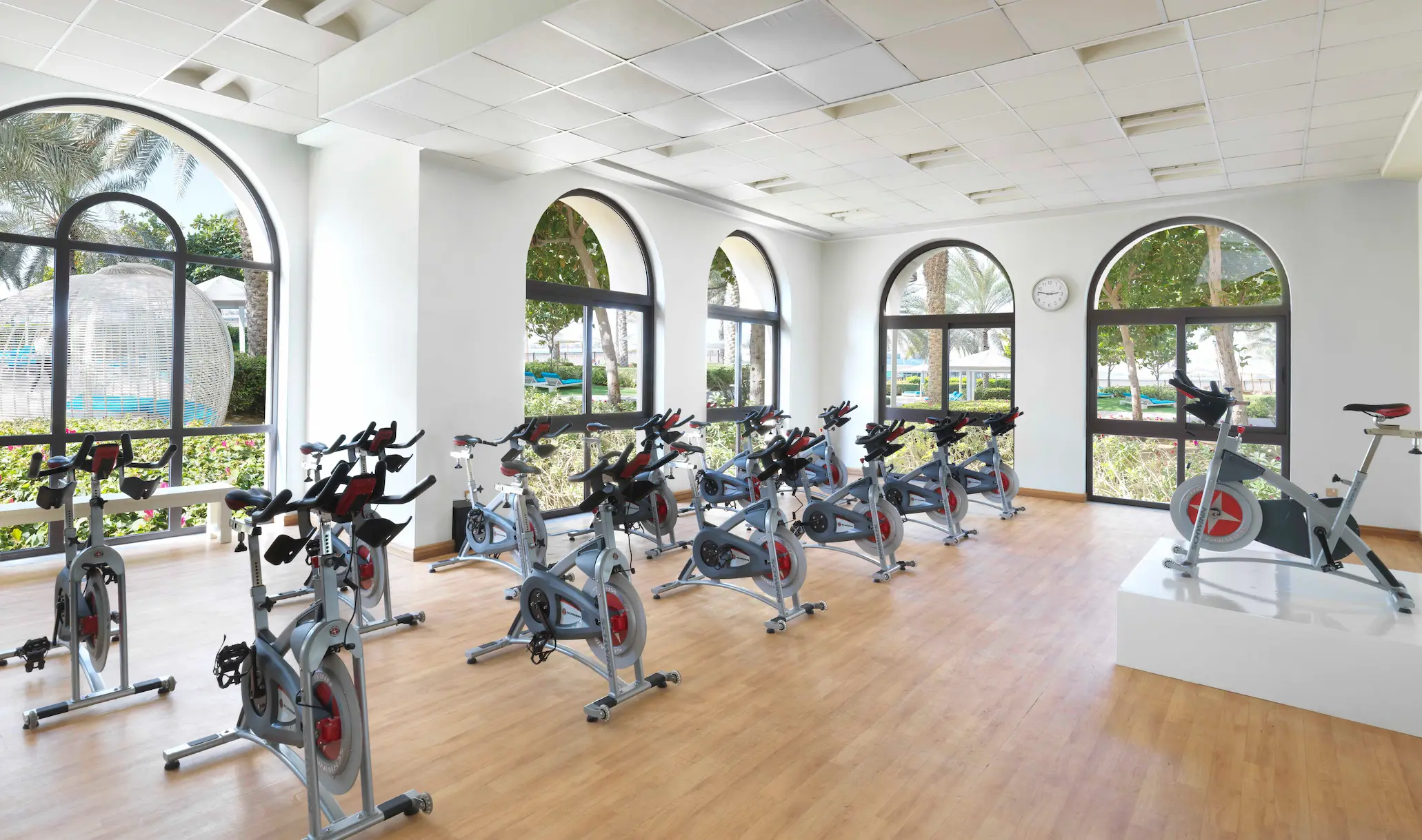 spin studio at ftp north gym fairmont the palm dubai health club with stationary bikes and modern lighting