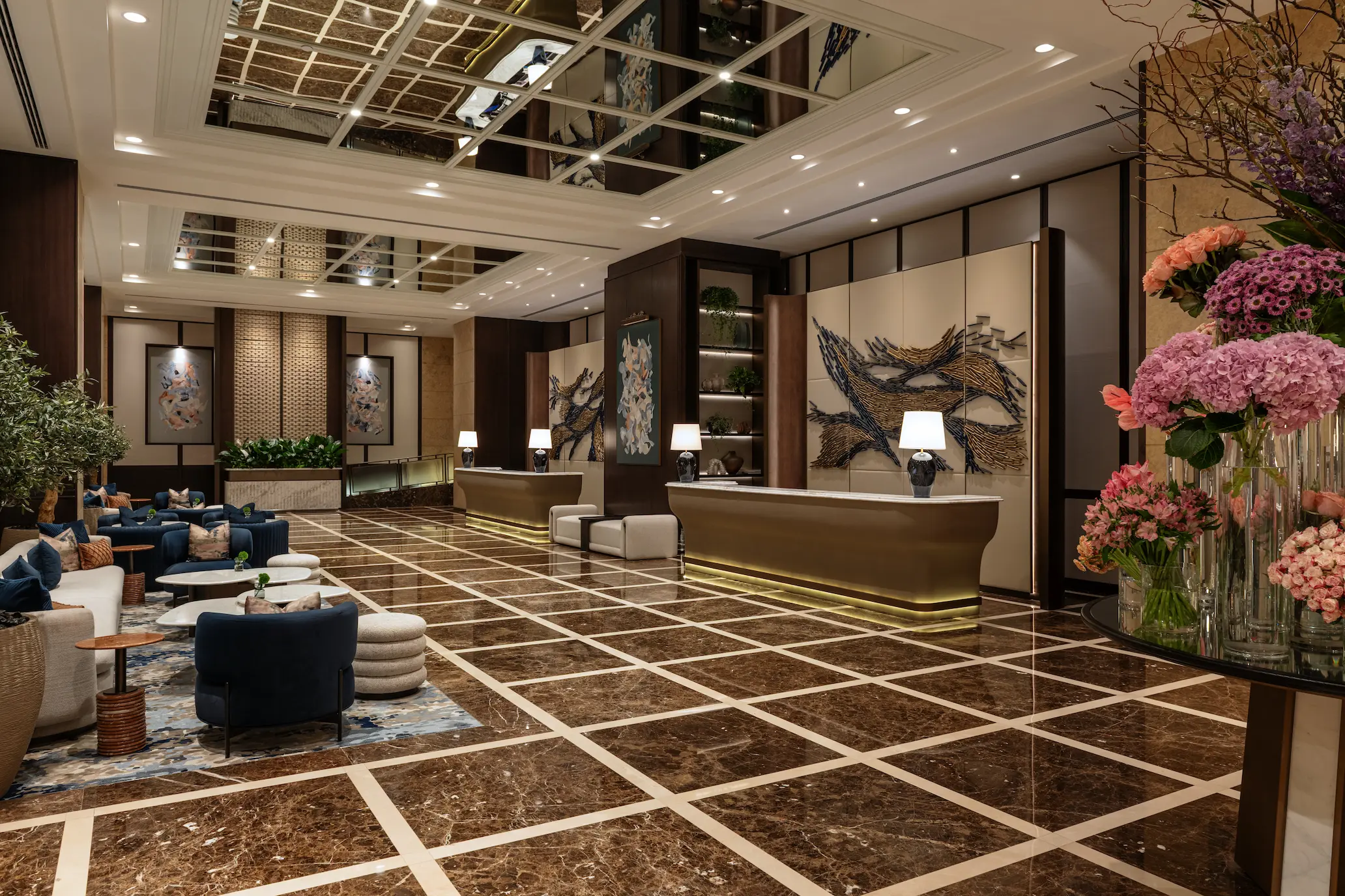 grosvenor house dubai lobby concierge featuring a refined guest welcome desk and elegant luxury service setting