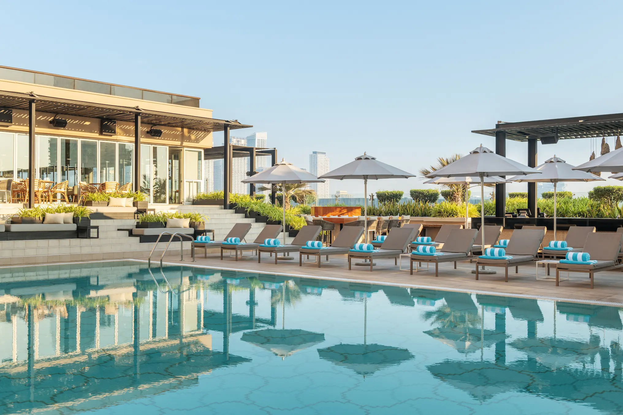 grosvenor house dubai pool featuring an elegant outdoor setting with refined luxury ambiance