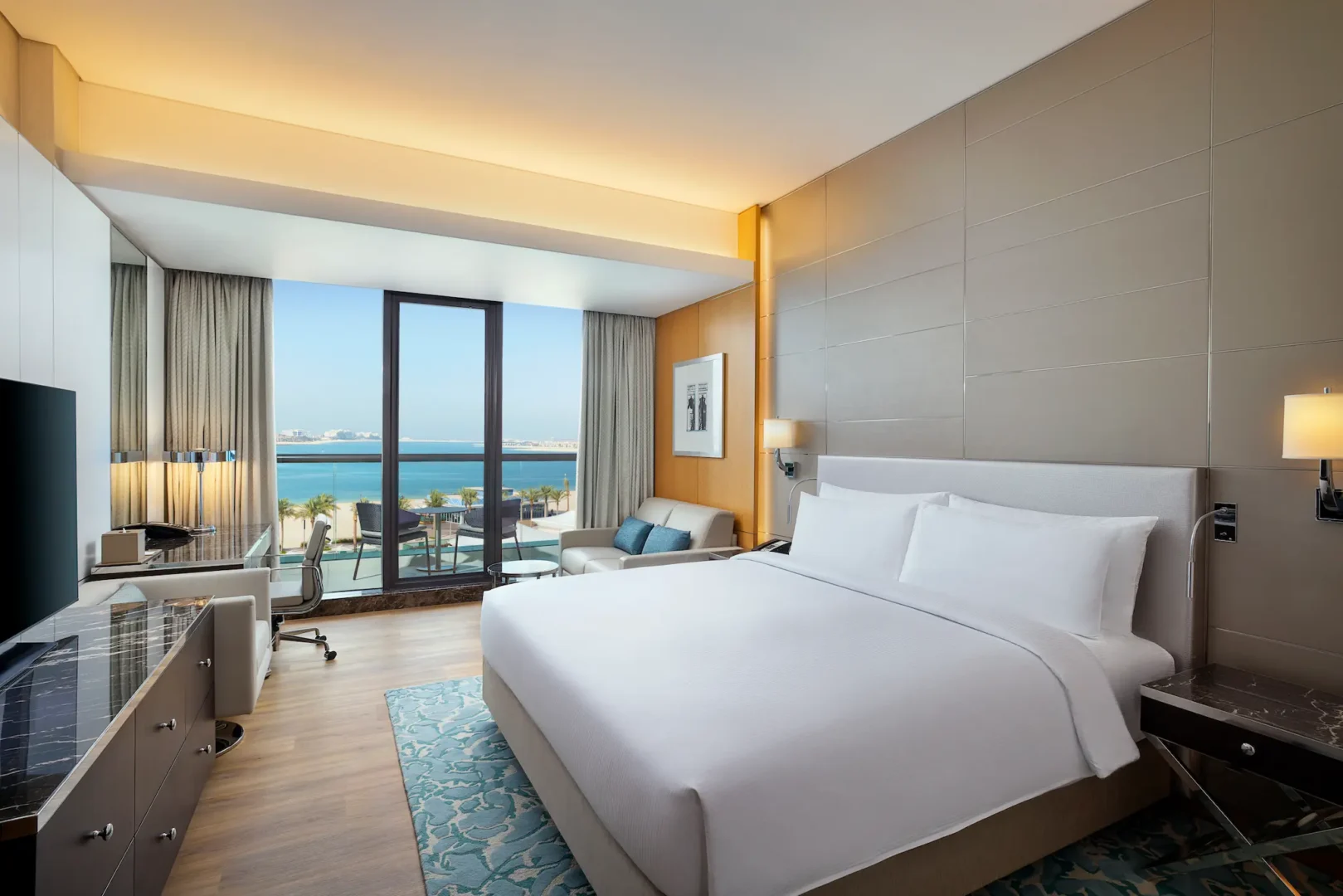 king executive room with sea view at hilton dubai palm jumeirah featuring private balcony and contemporary interiors