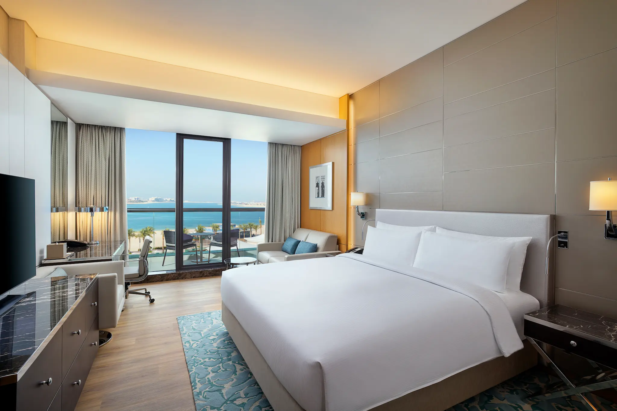 king executive room with sea view at hilton dubai palm jumeirah featuring private balcony and contemporary interiors
