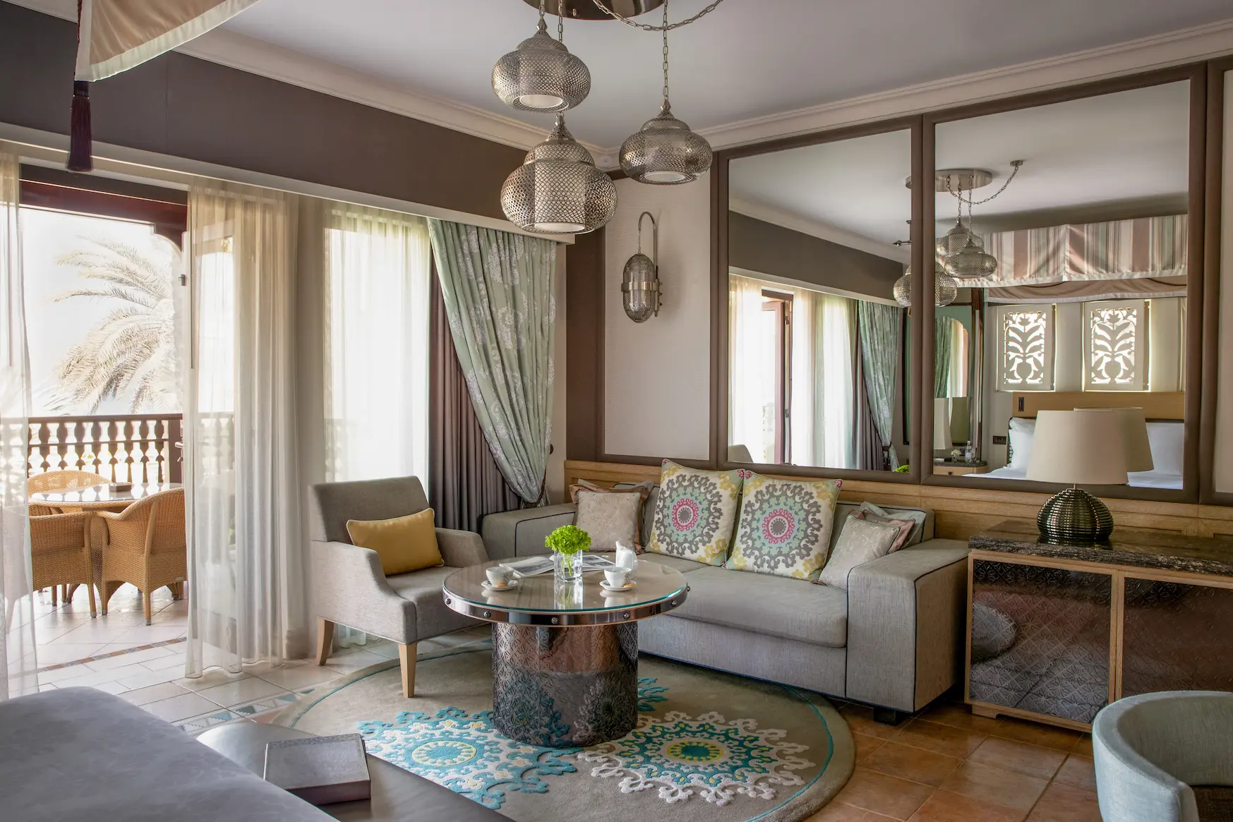 jumeirah dar al masyaf cove house garden room living area elegant lounge space with soft furnishings and tranquil garden villa ambiance