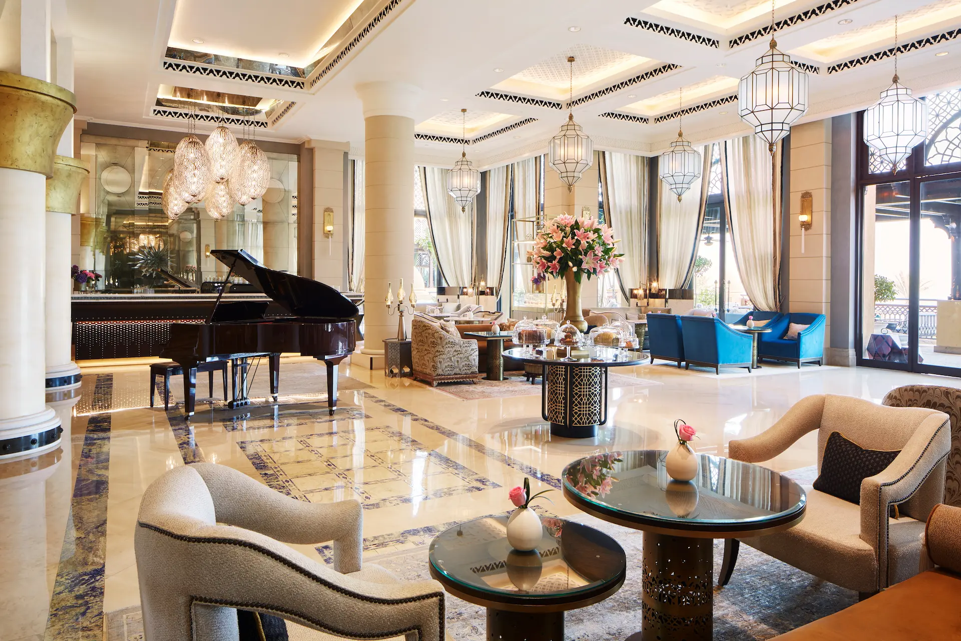 al samar lounge indoor seating at jumeirah mina a salam dubai featuring elegant arabian décor, plush armchairs, warm lighting and views across the madinat jumeirah waterways