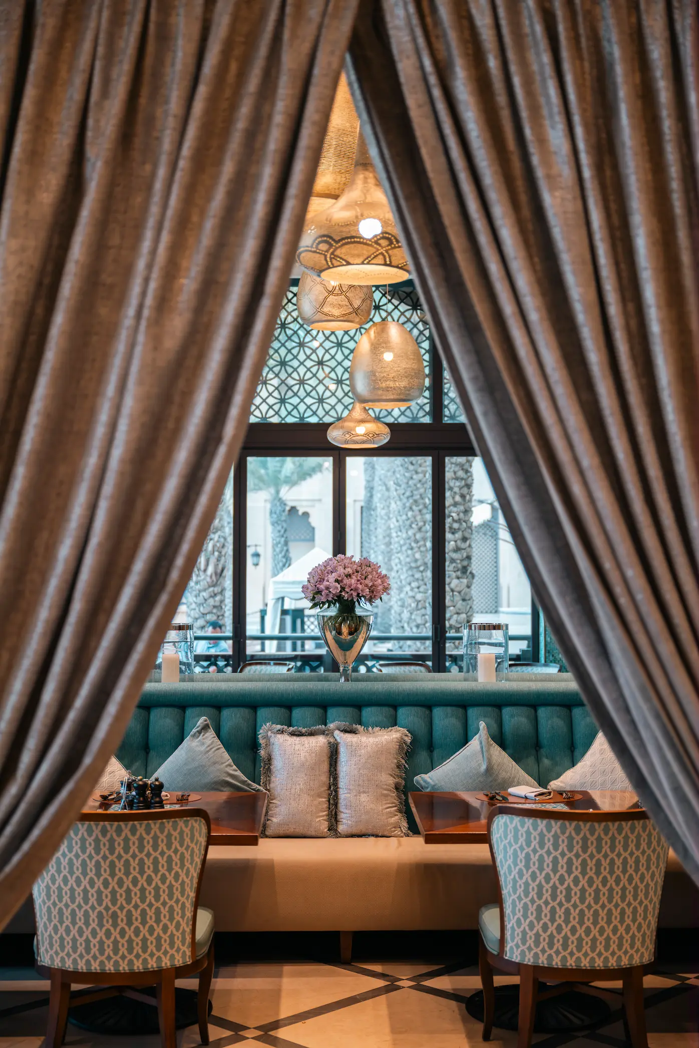 hanayaa restaurant curtain at jumeirah mina a salam dubai featuring traditional arabian fabric design, warm textures and decorative detailing within the dining space