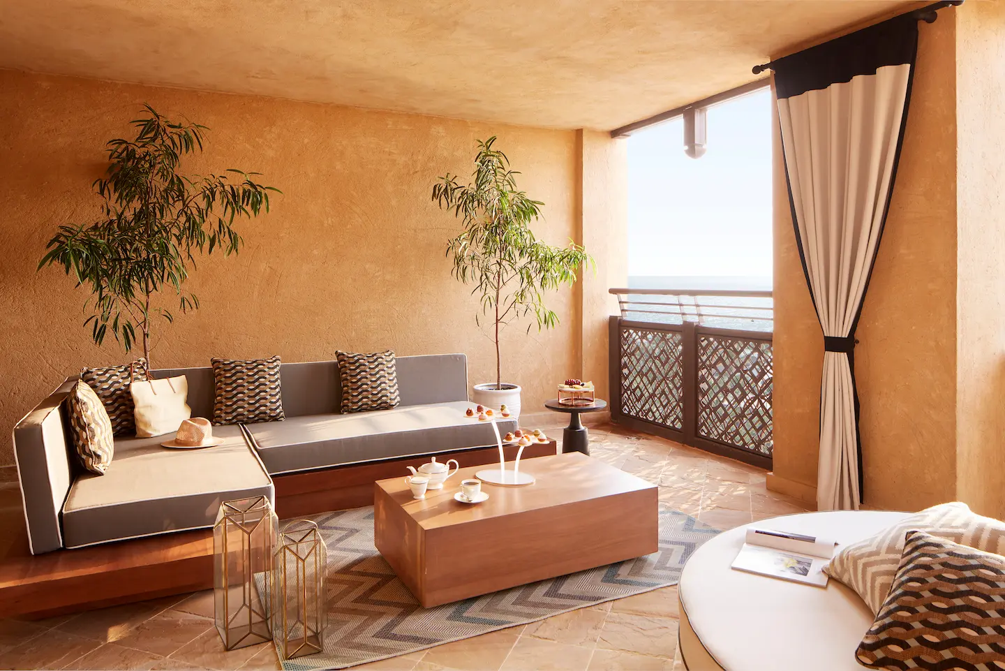 ocean suite balcony at jumeirah mina a salam dubai featuring outdoor seating area with panoramic views of the arabian gulf and the resort’s private beach