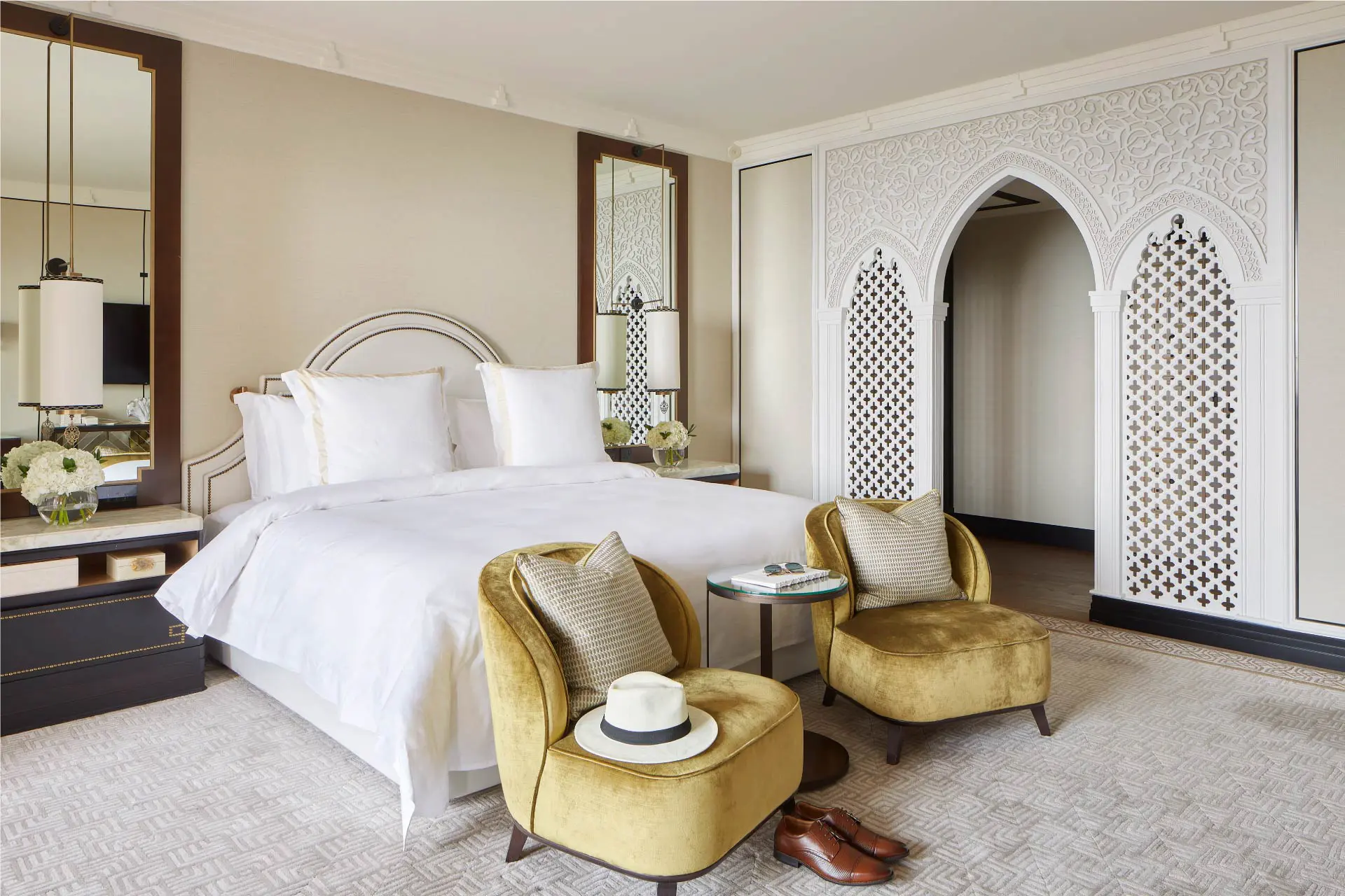 ocean premier suite bedroom at jumeirah mina al salam dubai featuring a spacious king-size bed, refined arabian décor, elegant furnishings and private balcony with panoramic views of the arabian gulf