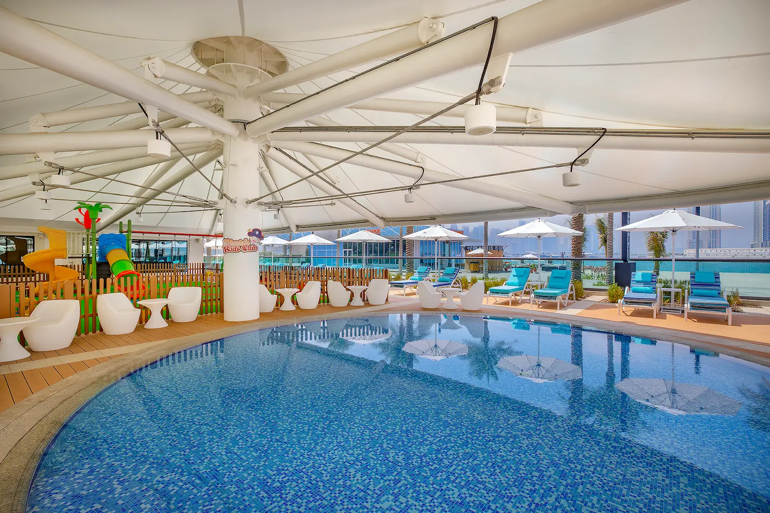 kids pool at hilton dubai palm jumeirah with shaded water play area and safe swimming