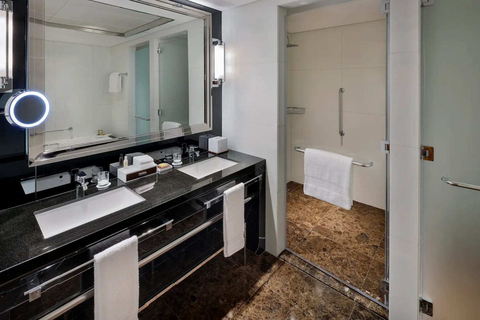 king one bedroom suite with sea view balcony bathroom at hilton dubai palm jumeirah