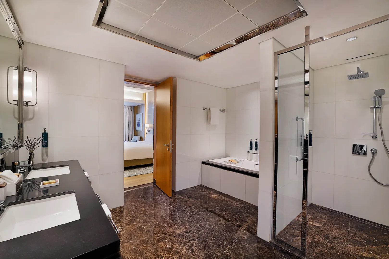 king one bedroom suite with sea view balcony shower at hilton dubai palm jumeirah