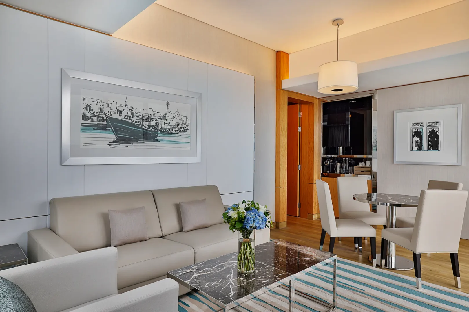 king one bedroom suite with sea view balcony sofa at hilton dubai palm jumeirah