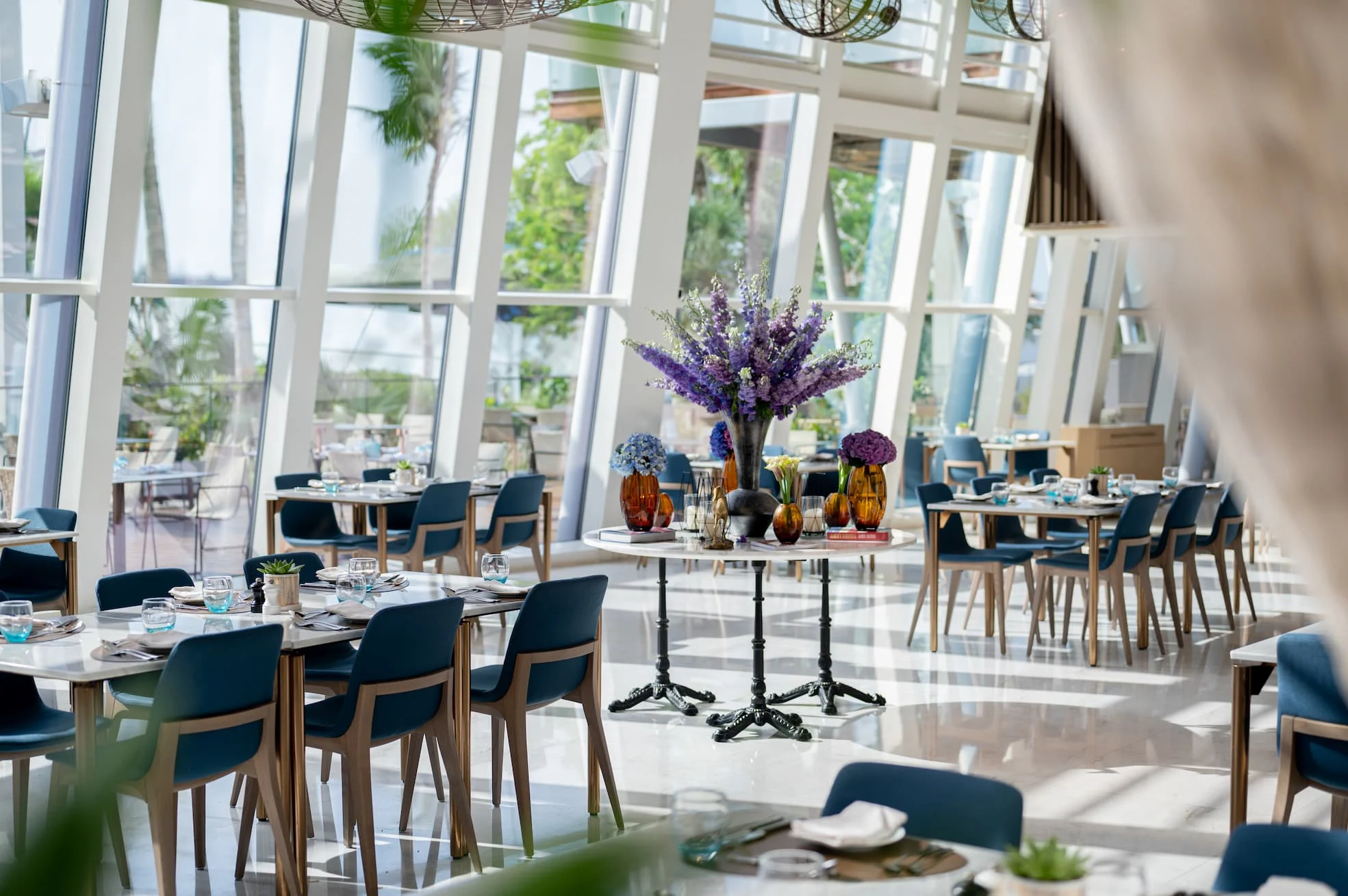 wide shot of kitchen connection restaurant at Jumeirah Beach Hotel showing contemporary dining space with open kitchen concept and relaxed family-friendly atmosphere