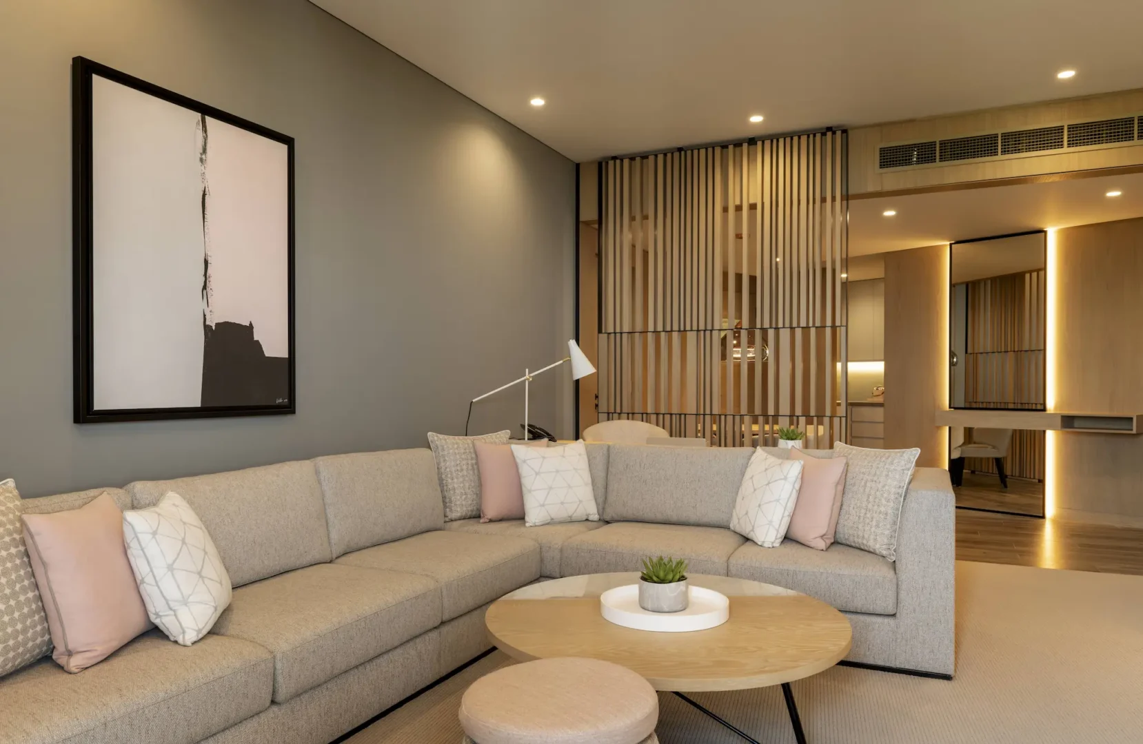 club suite lounge at le royal meridien beach resort and spa dubai featuring contemporary furnishings, spacious seating area and large windows with views of the resort gardens and arabian gulf