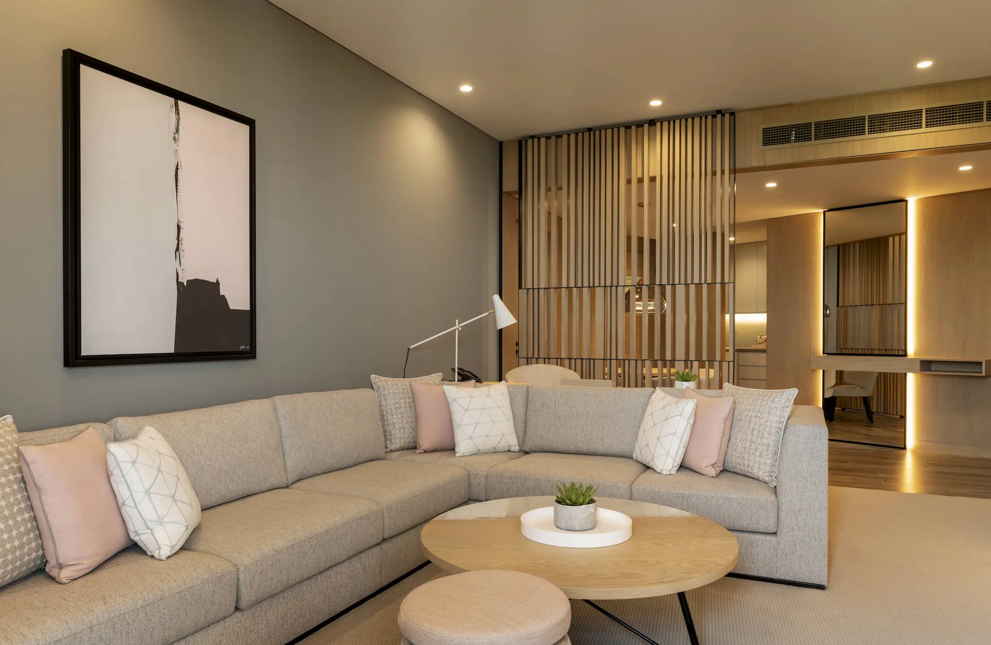 club suite lounge at le royal meridien beach resort and spa dubai featuring contemporary furnishings, spacious seating area and large windows with views of the resort gardens and arabian gulf