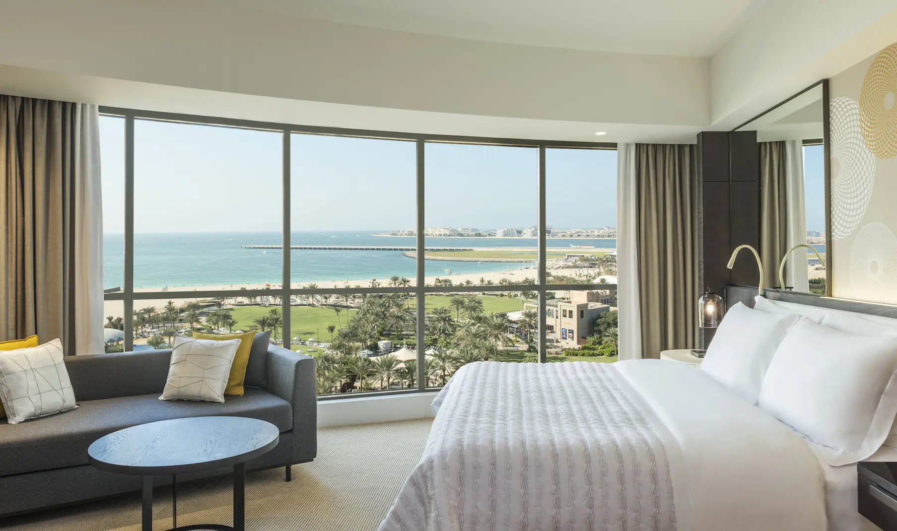 deluxe suite view at le royal meridien beach resort and spa dubai featuring panoramic vistas of the arabian gulf and the resort’s landscaped gardens