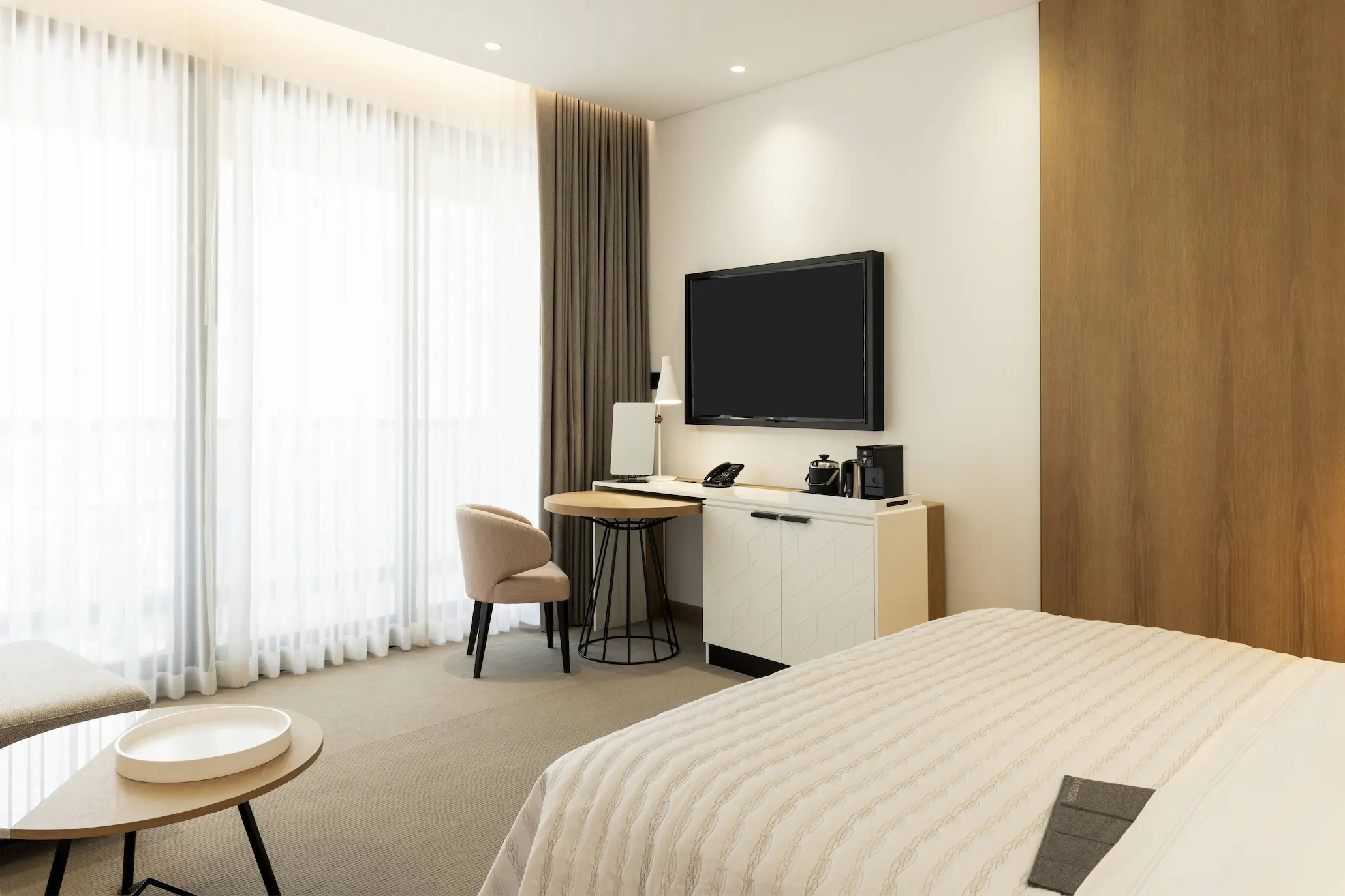 royal club king bedroom at le royal meridien beach resort and spa dubai featuring king-size bed, modern elegant décor and large windows with views of the arabian gulf or resort gardens