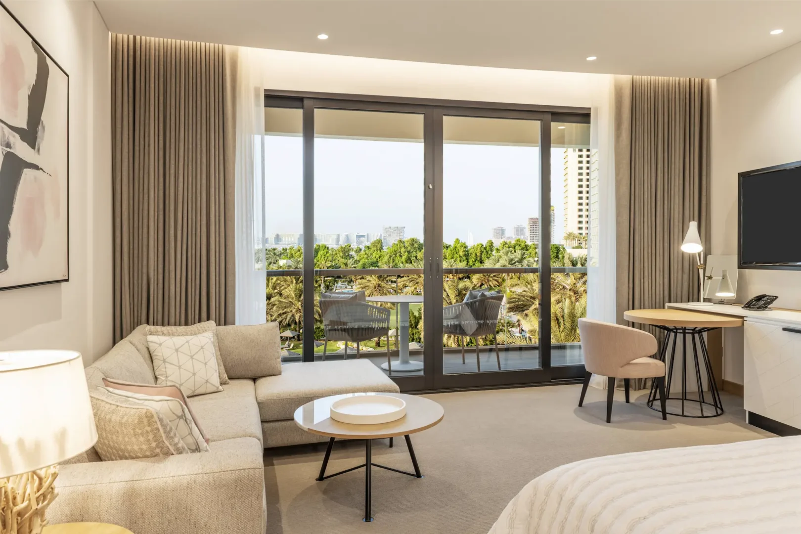 royal club king bedroom at le royal meridien beach resort and spa dubai featuring king-size bed, elegant modern décor and large windows with views of the arabian gulf or resort gardens