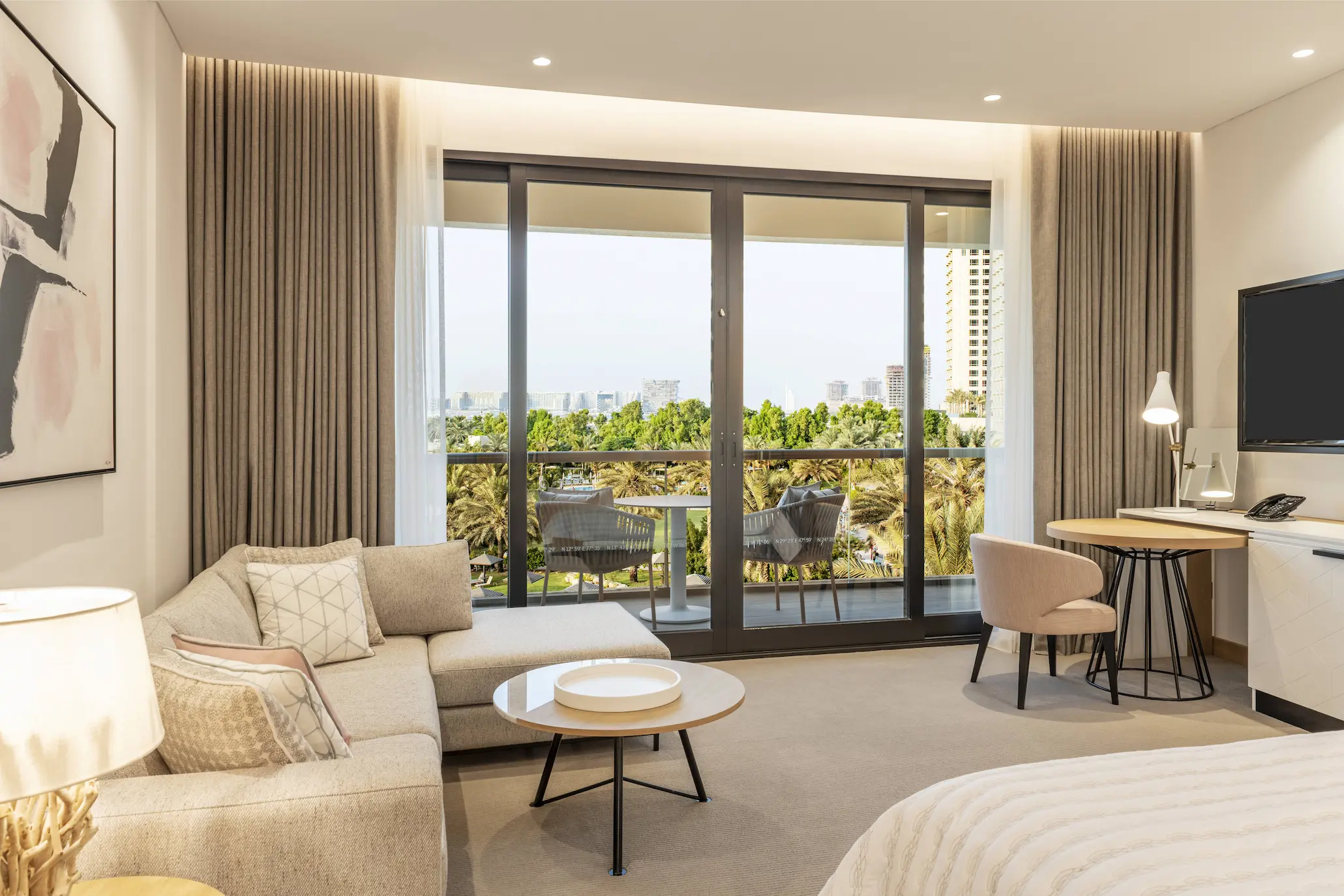 royal club king bedroom at le royal meridien beach resort and spa dubai featuring king-size bed, elegant modern décor and large windows with views of the arabian gulf or resort gardens