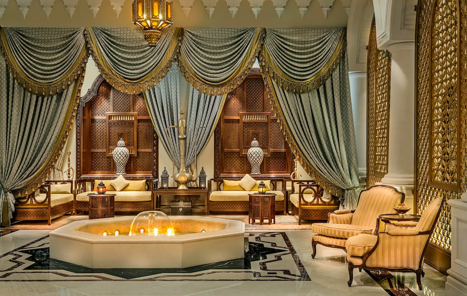 lobby majlis at the ritz-carlton dubai jbr featuring traditional arabian seating, elegant interiors, and luxury beachfront hotel ambiance in dubai marina