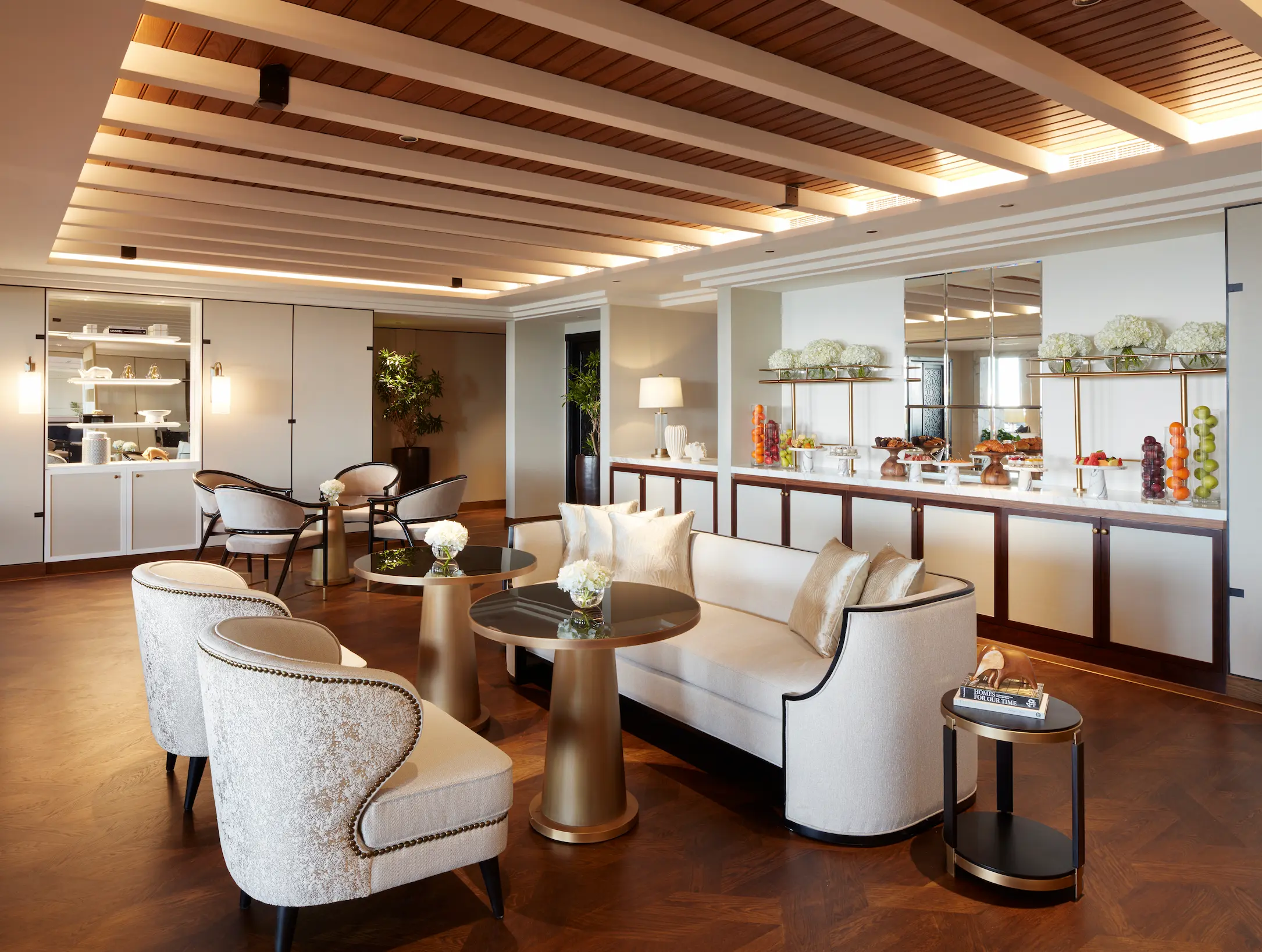 amal club lounge seating area at jumeirah mina a salam madinat jumeirah dubai featuring elegant arabian interiors, comfortable lounge seating and warm ambient lighting overlooking the resort waterways