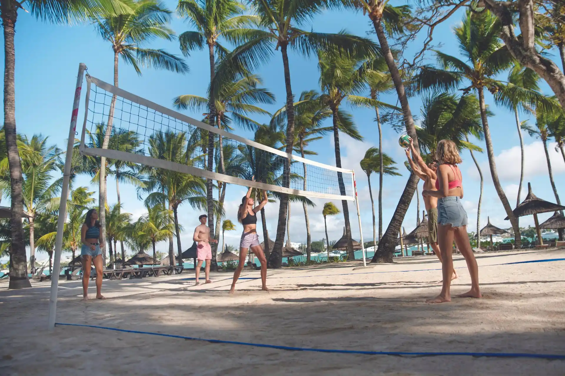 mauricia mauritius land sports activities including beach volleyball in tropical resort setting