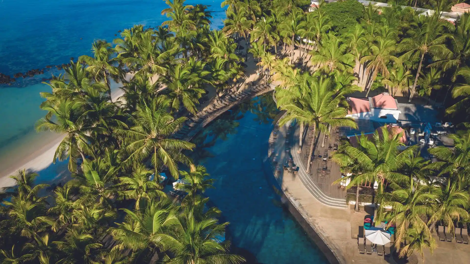mauricia mauritius birds eye view of beachfront resort with tropical gardens and turquoise lagoon
