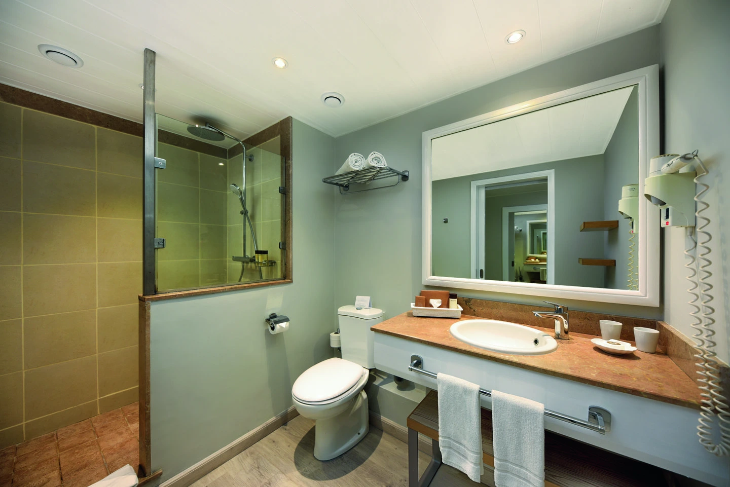 mauricia standard room bathroom with modern fixtures and bright tropical design
