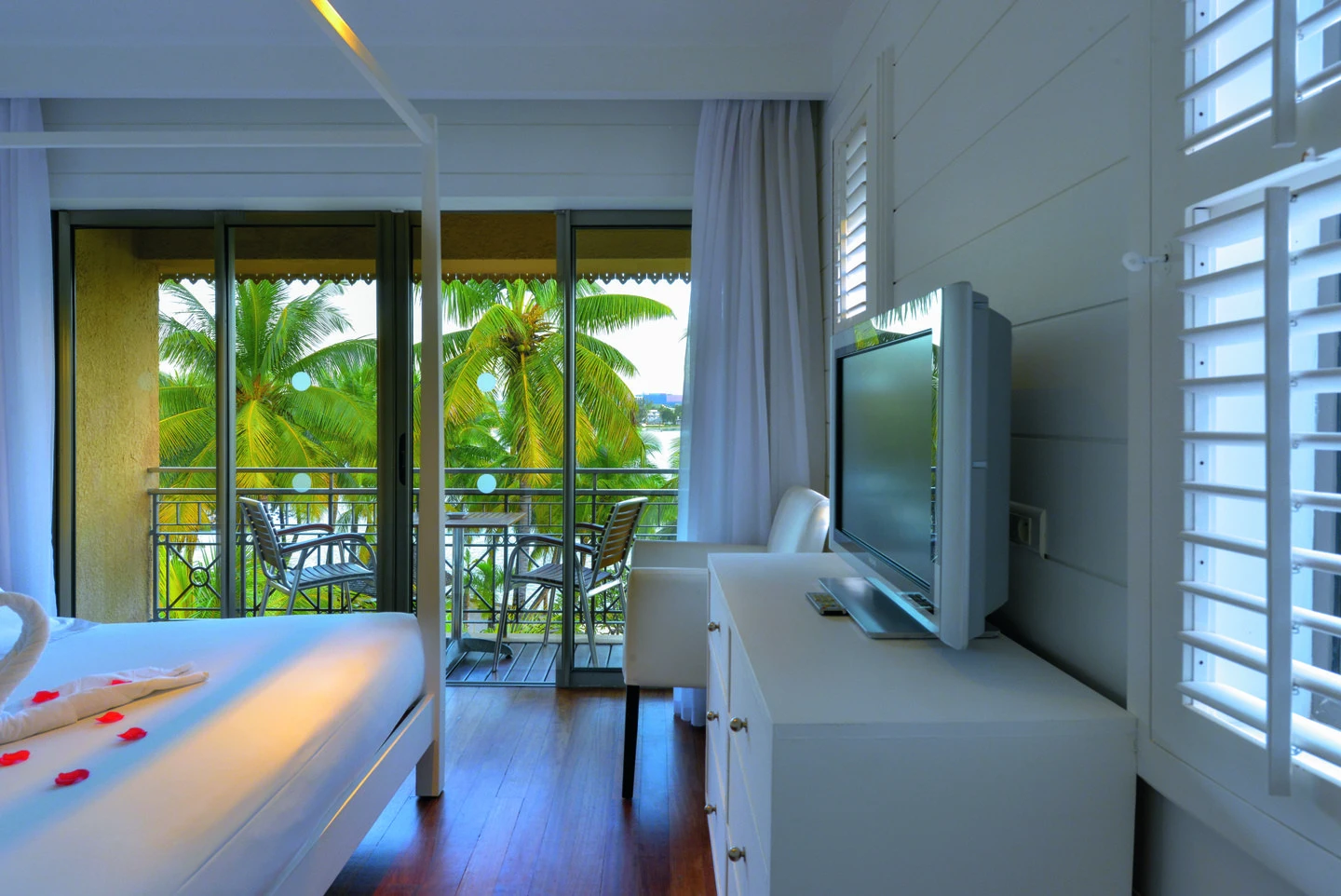 mauricia suite balcony with ocean view and tropical resort setting