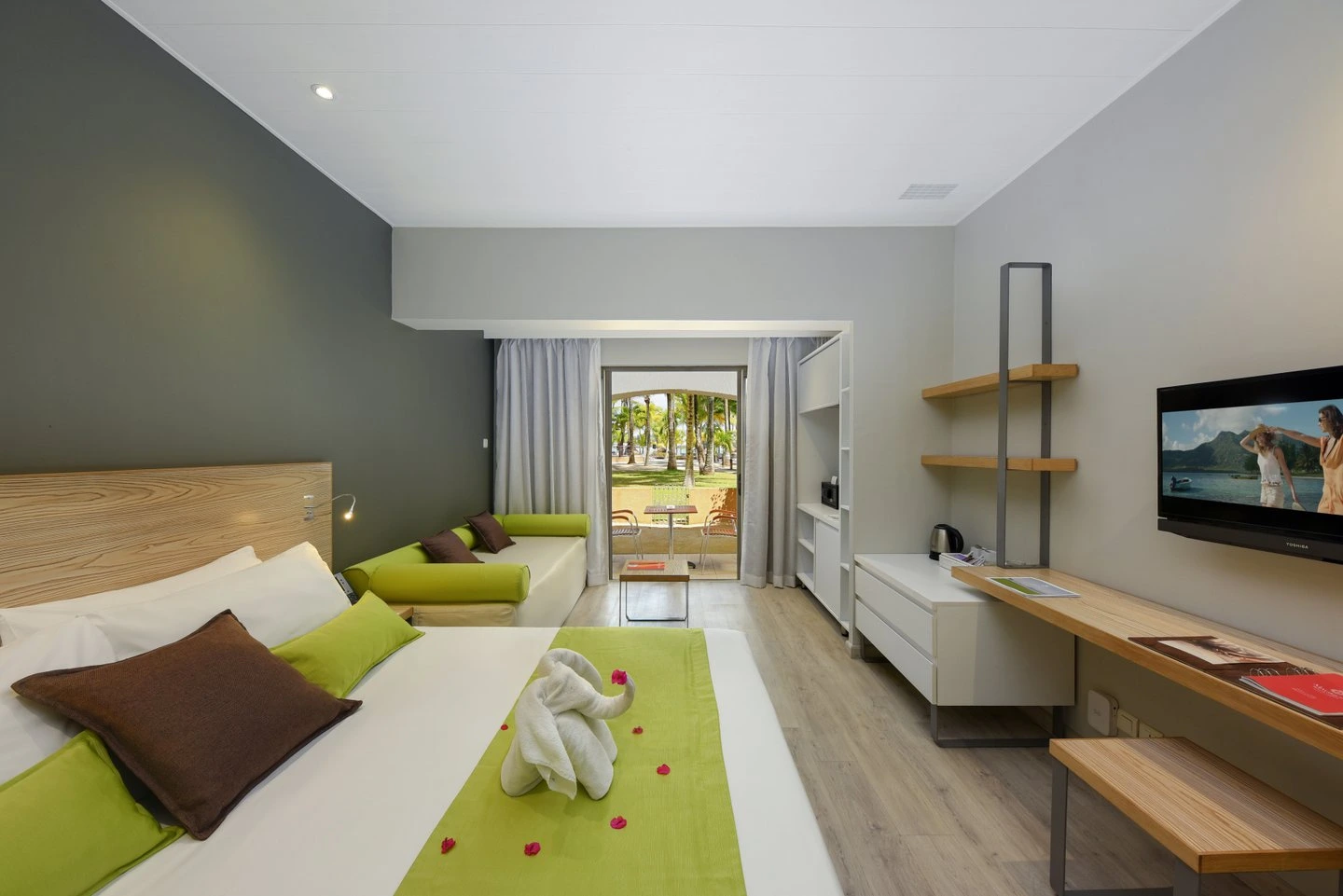 mauricia superior room with spacious bedroom, and tropical resort views