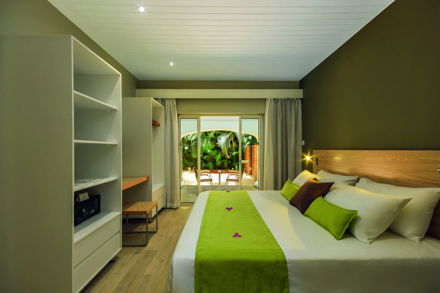 mauricia two bedroom family apartment terrace with seating area and tropical garden views