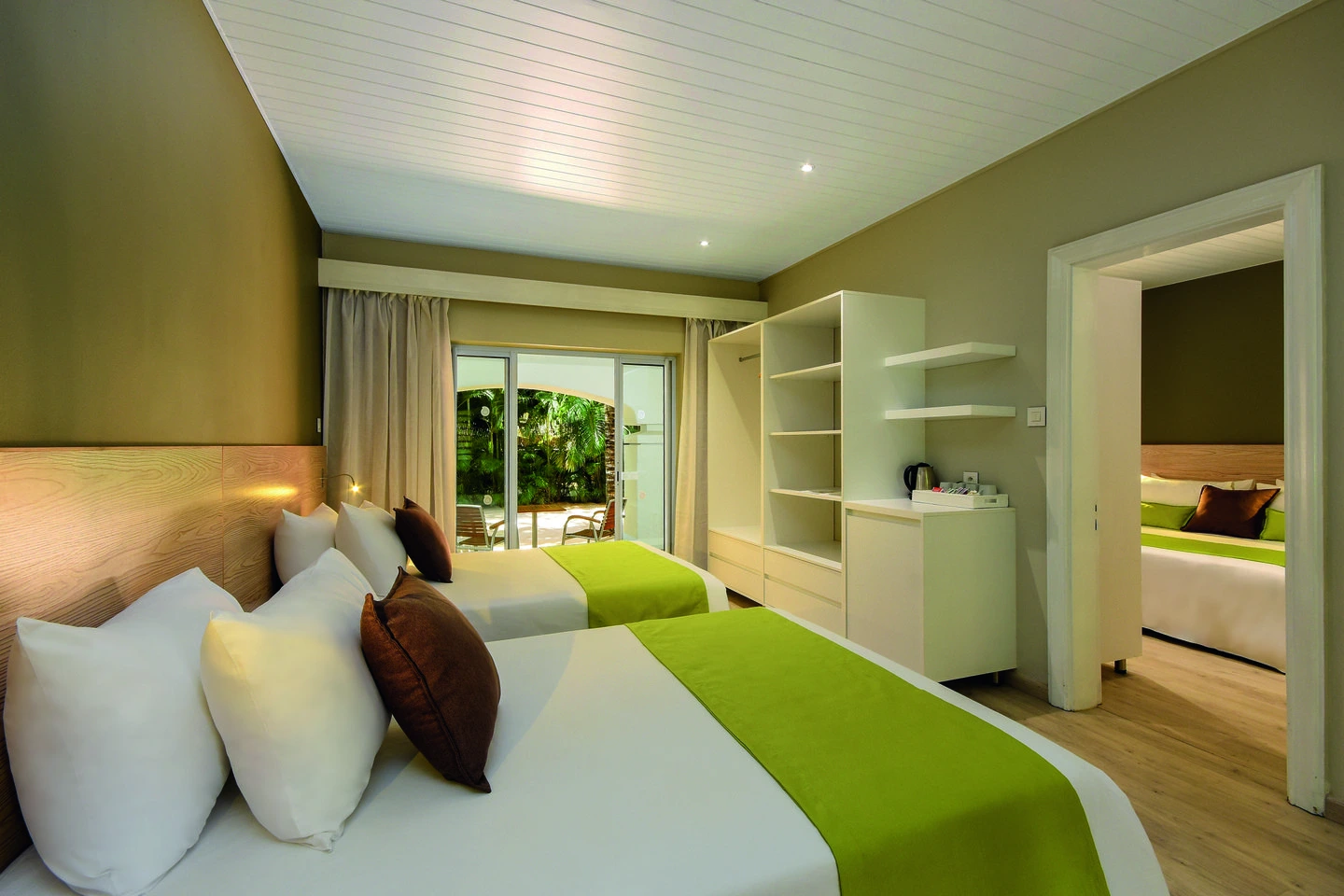 mauricia two bedroom family apartment twin room with two single beds and tropical decor