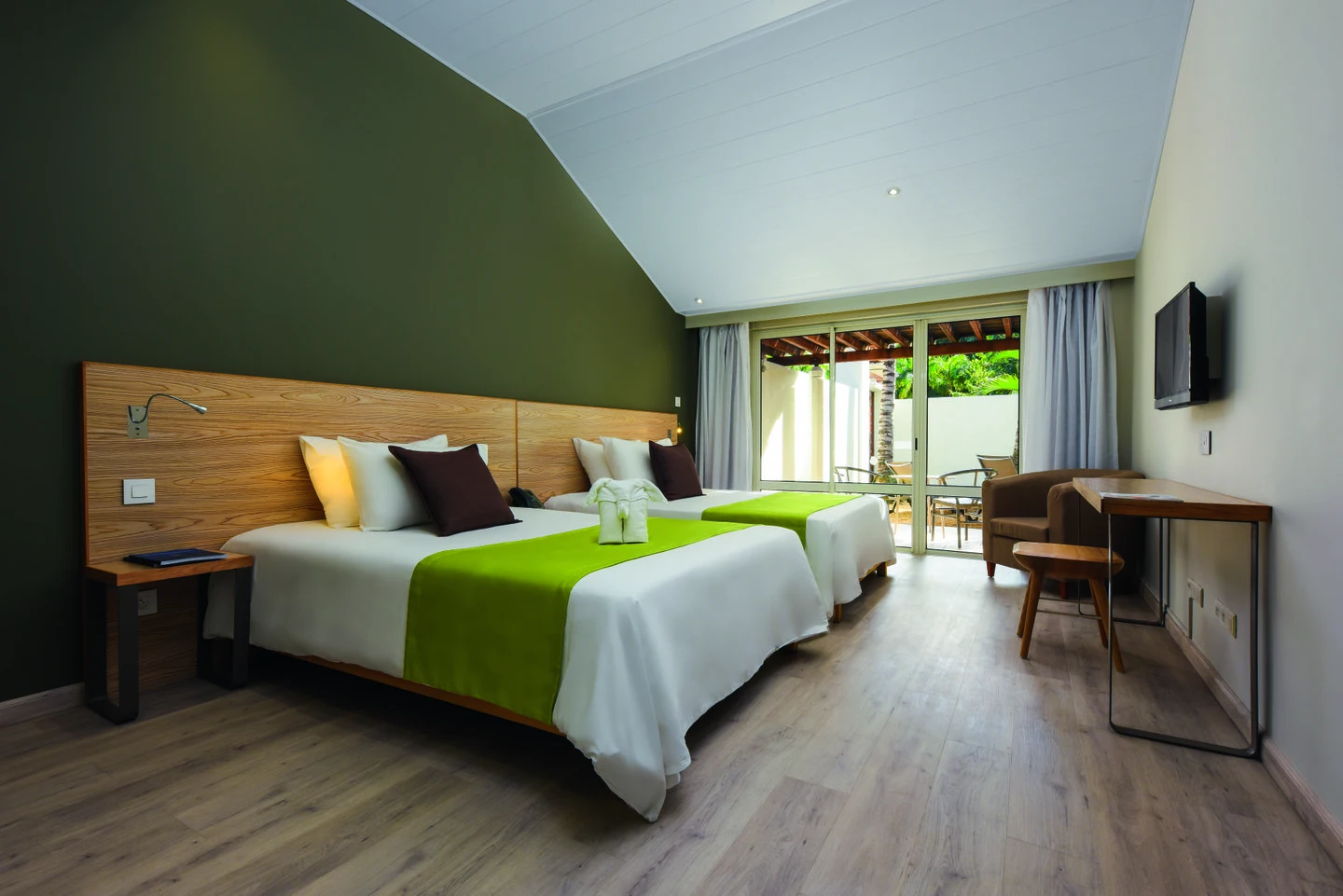 mauricia villa bedroom with king size bed and tropical garden views