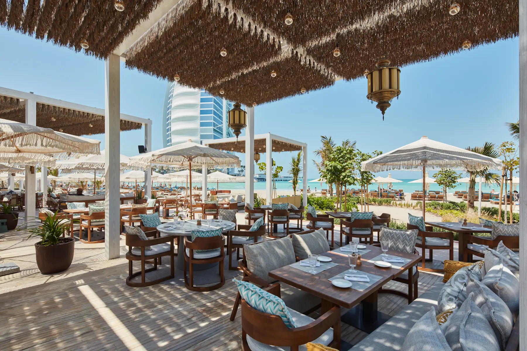 nuska beach interiors at Jumeirah Beach Hotel featuring stylish coastal décor, relaxed seating and contemporary dining atmosphere