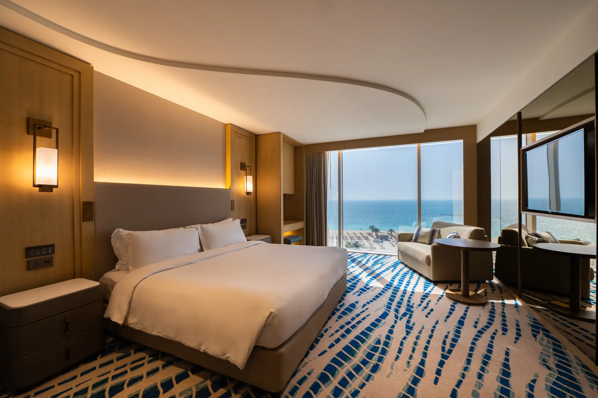 ocean deluxe master bedroom at Jumeirah Beach Hotel with king bed and sea view