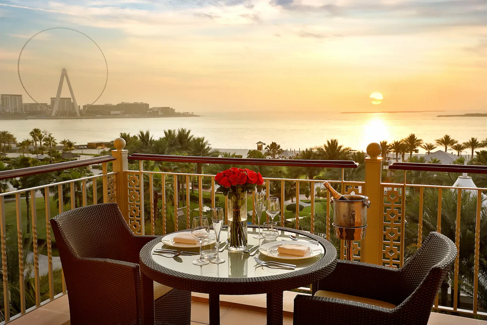 romantic balcony setup with ocean view at the ritz-carlton dubai jbr featuring intimate seating and arabian gulf backdrop for couples luxury beachfront experience in dubai marina
