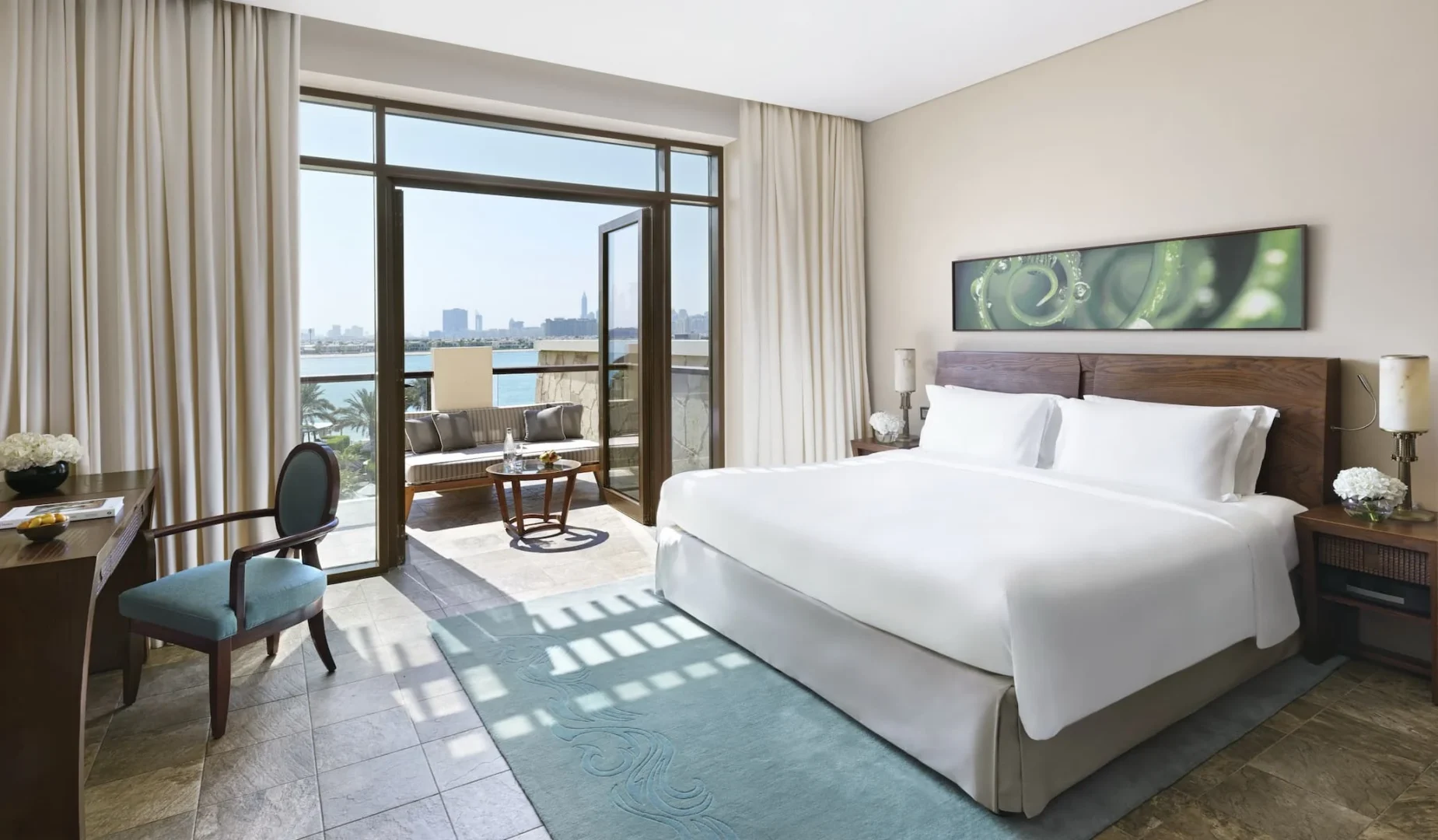 luxury palm view room at sofitel dubai the palm with modern decor, king bed, private balcony overlooking palm fronds and sea, elegant furnishings
