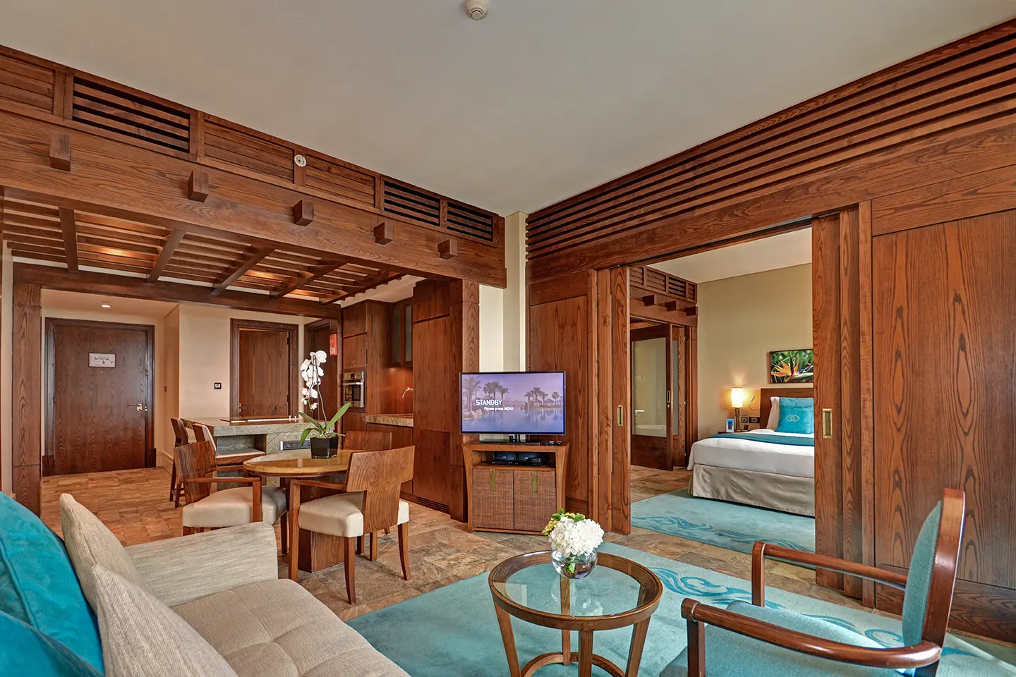 living area in one-bedroom apartment at sofitel dubai the palm with modern decor, comfortable seating, and sea or resort views