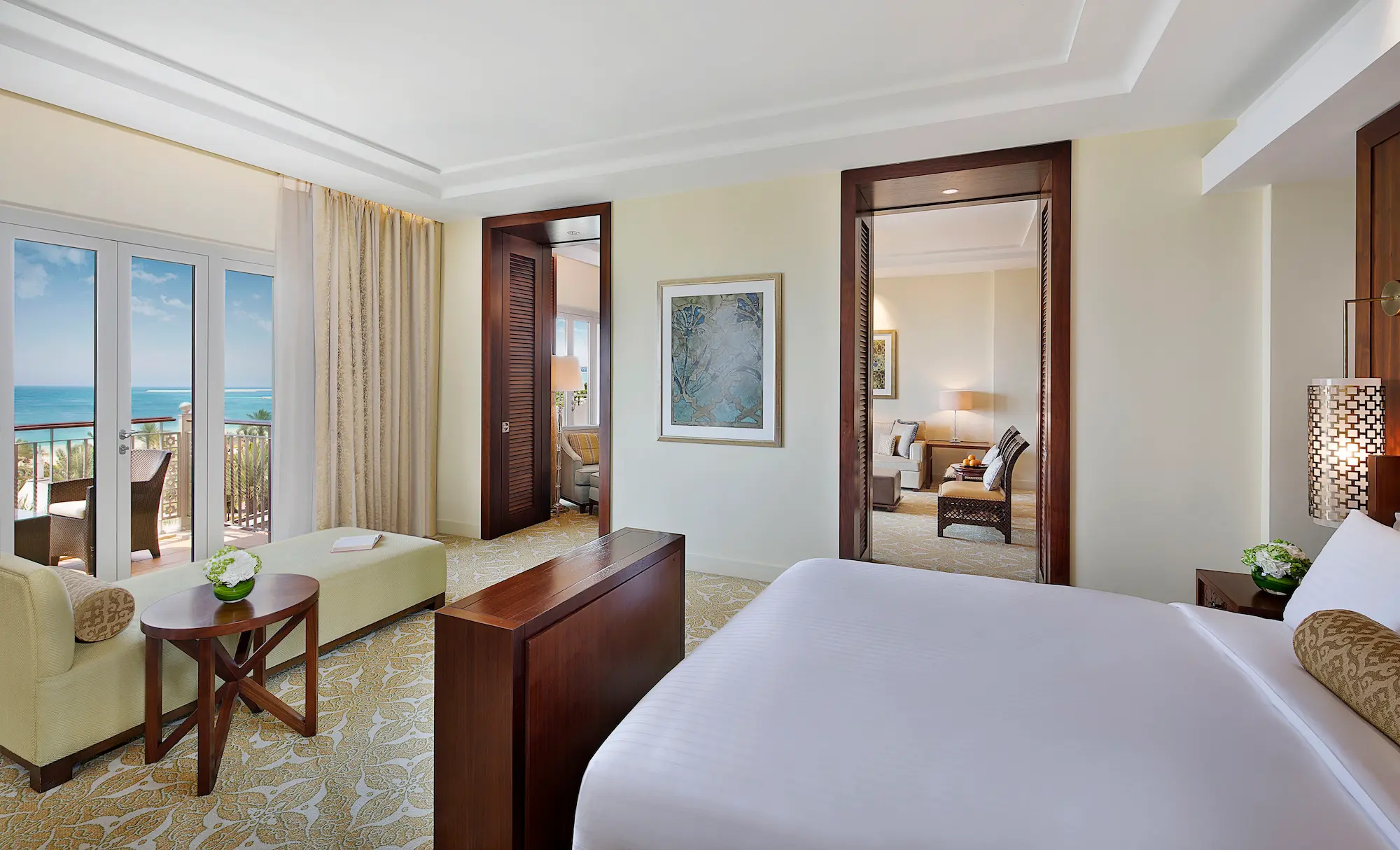 one bedroom club suite with ocean view at the ritz-carlton dubai jbr luxury beachfront hotel featuring spacious living area, elegant interiors, and private balcony overlooking the arabian gulf