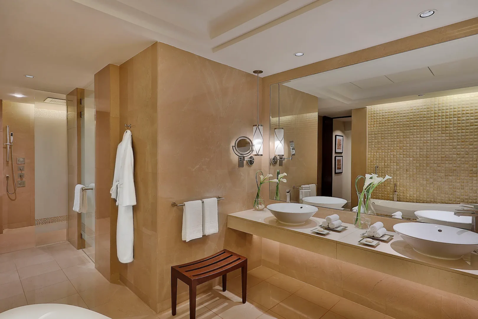 bathroom in one bedroom ocean club suite at the ritz-carlton dubai jbr featuring marble finishes, deep soaking bathtub, walk-in shower, and luxury amenities with arabian gulf views