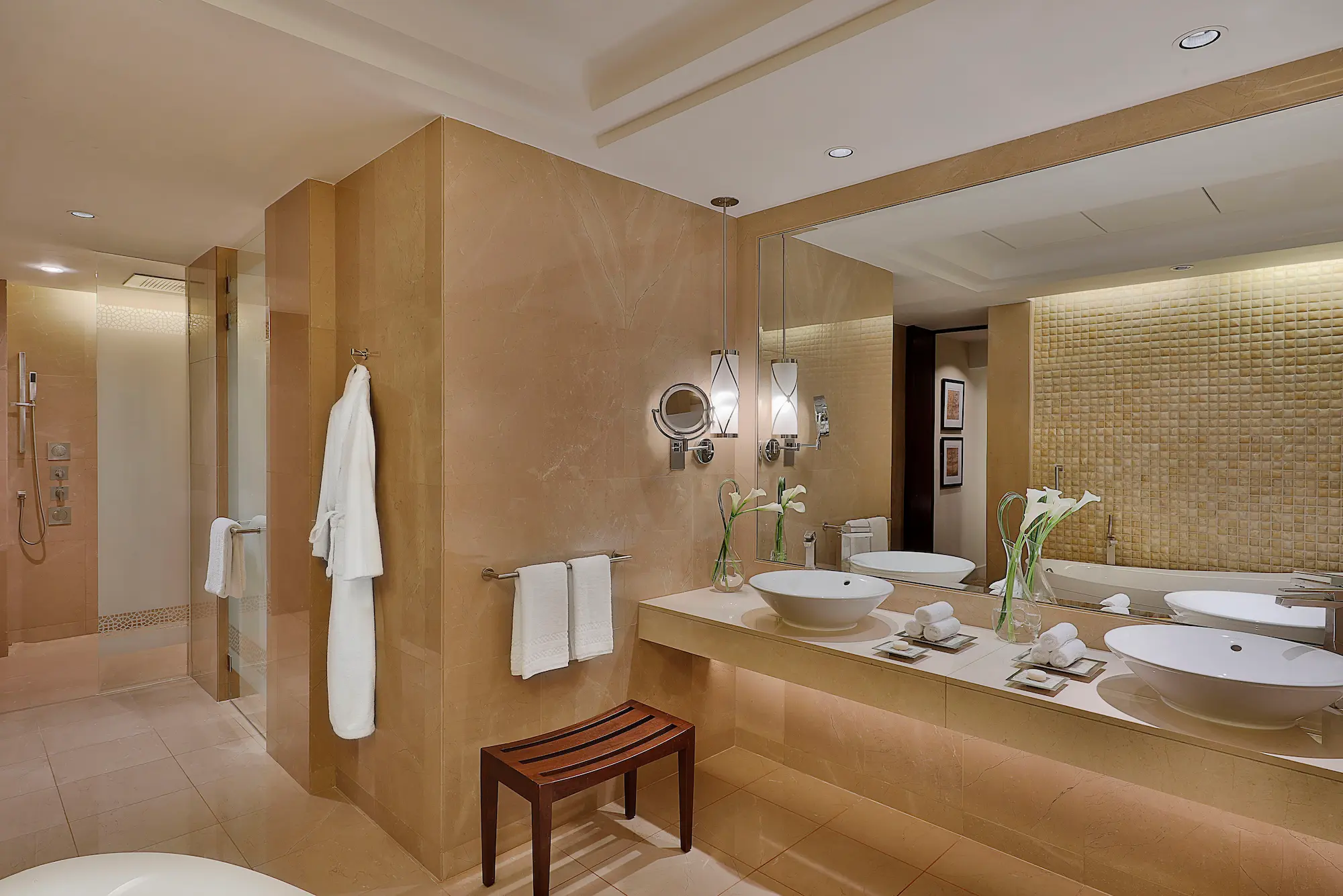 bathroom in one bedroom ocean club suite at the ritz-carlton dubai jbr featuring marble finishes, deep soaking bathtub, walk-in shower, and luxury amenities with arabian gulf views