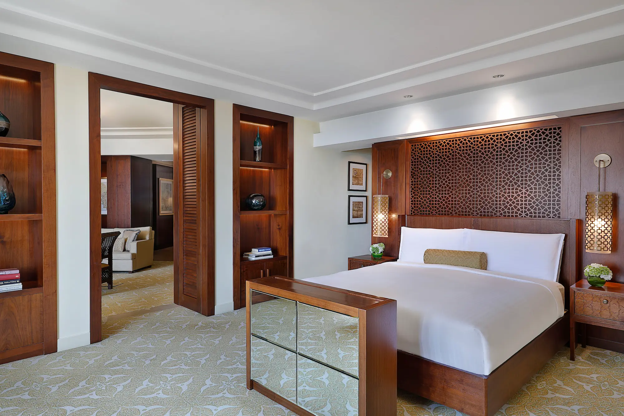 bedroom in one bedroom ocean club suite at the ritz-carlton dubai jbr luxury beachfront hotel featuring king bed, elegant interiors, and private balcony with arabian gulf views