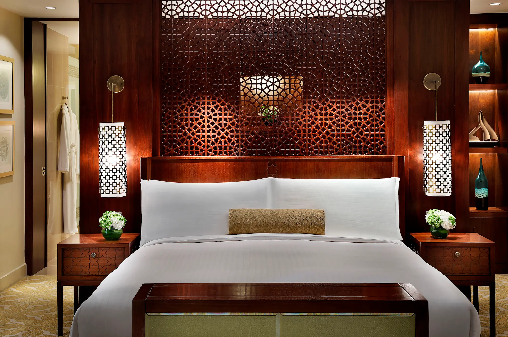 bedroom detail in one bedroom ocean club suite at the ritz-carlton dubai jbr featuring king bed, luxury linens, elegant furnishings, and arabian gulf views from private balcony