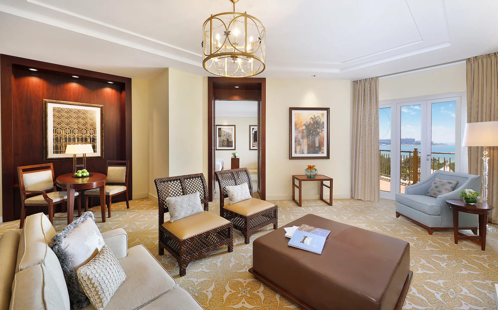 living room in one bedroom ocean club suite at the ritz-carlton dubai jbr luxury beachfront hotel featuring elegant seating area, modern interiors, and private balcony with arabian gulf views