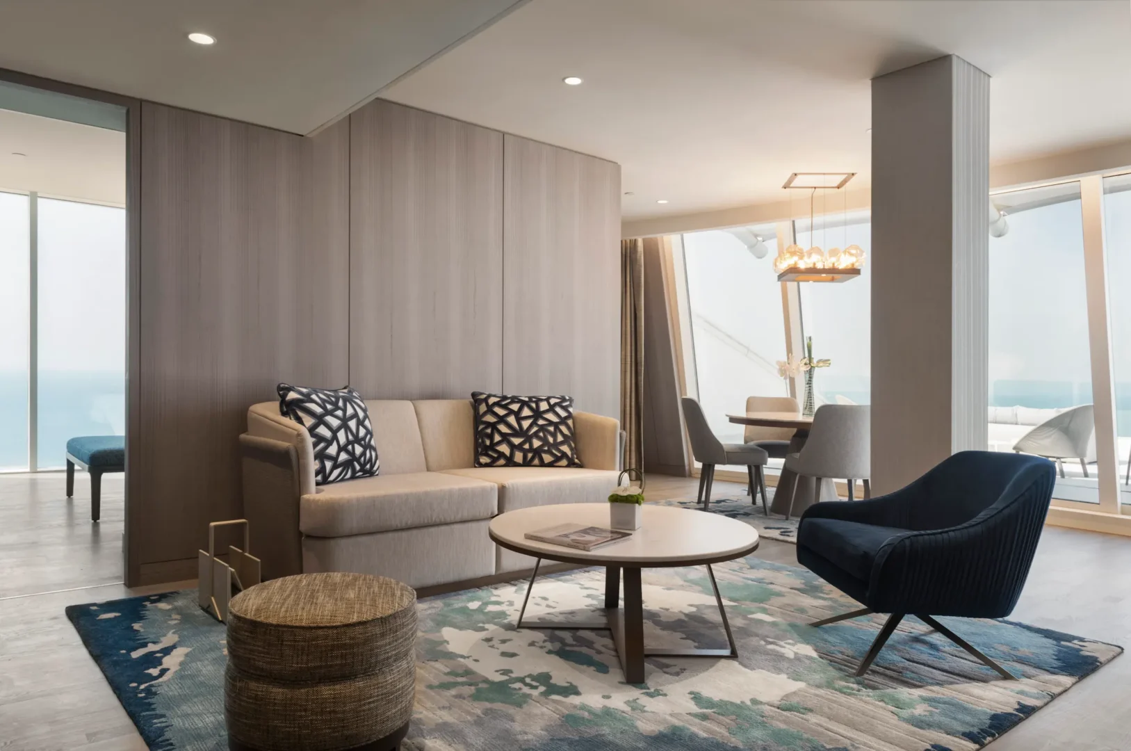 one bedroom suite at Jumeirah Beach Hotel with separate living area, king bed and panoramic sea views