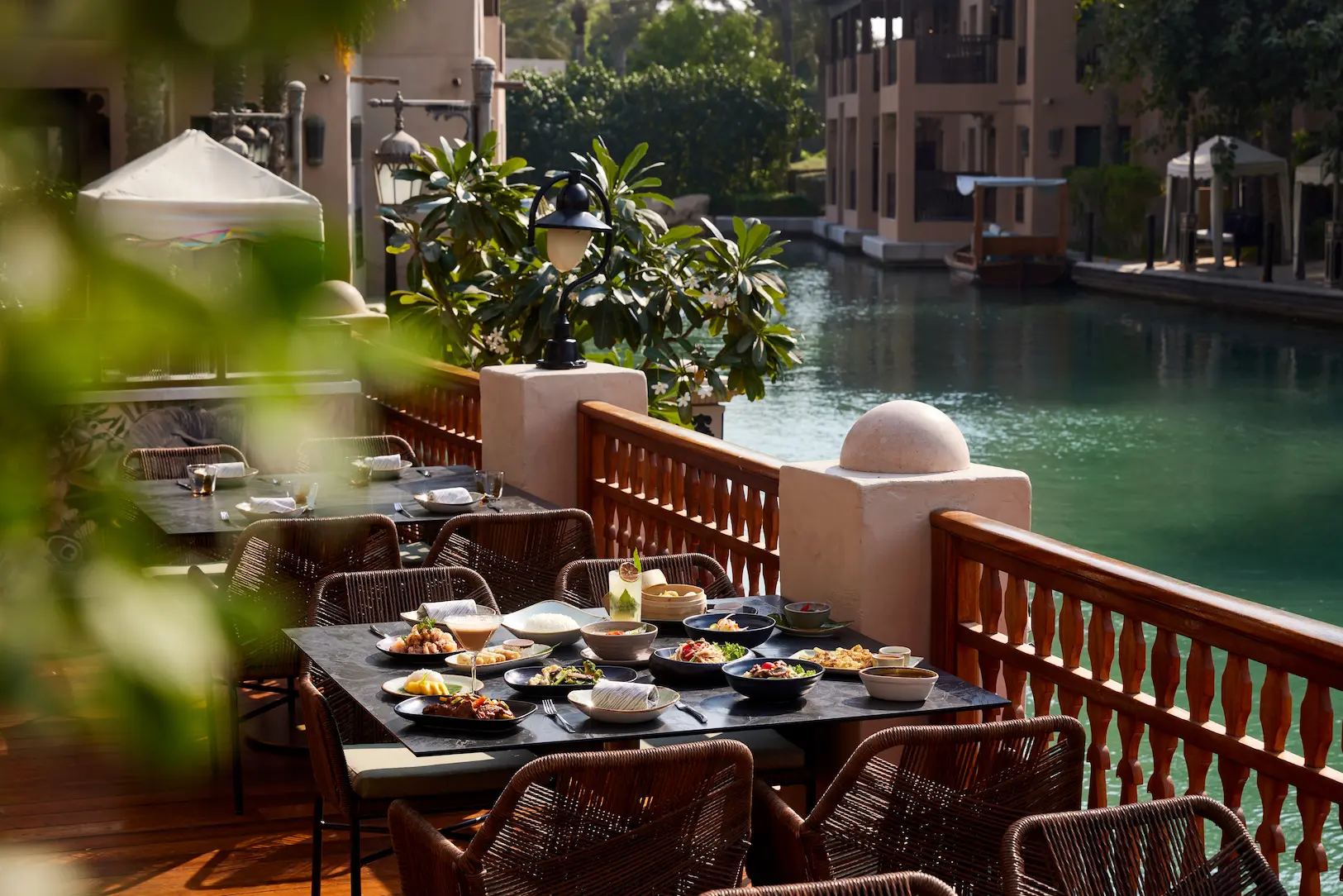 rite of siam brunch food setup at pai thai featuring colourful thai dishes presented in an elegant outdoor dining setting