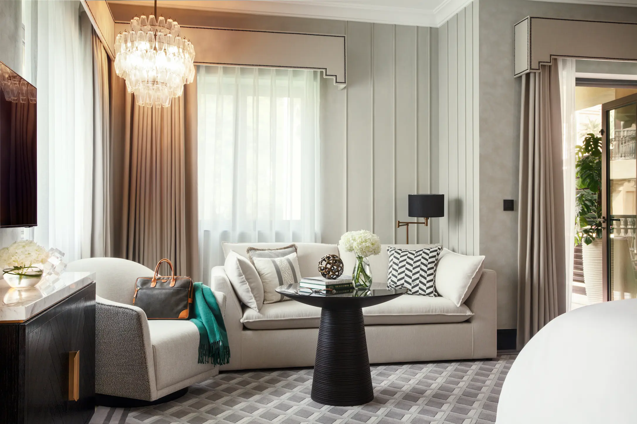 sitting area of palm house garden room at jumeirah dar al masyaf with comfortable seating and stylish décor