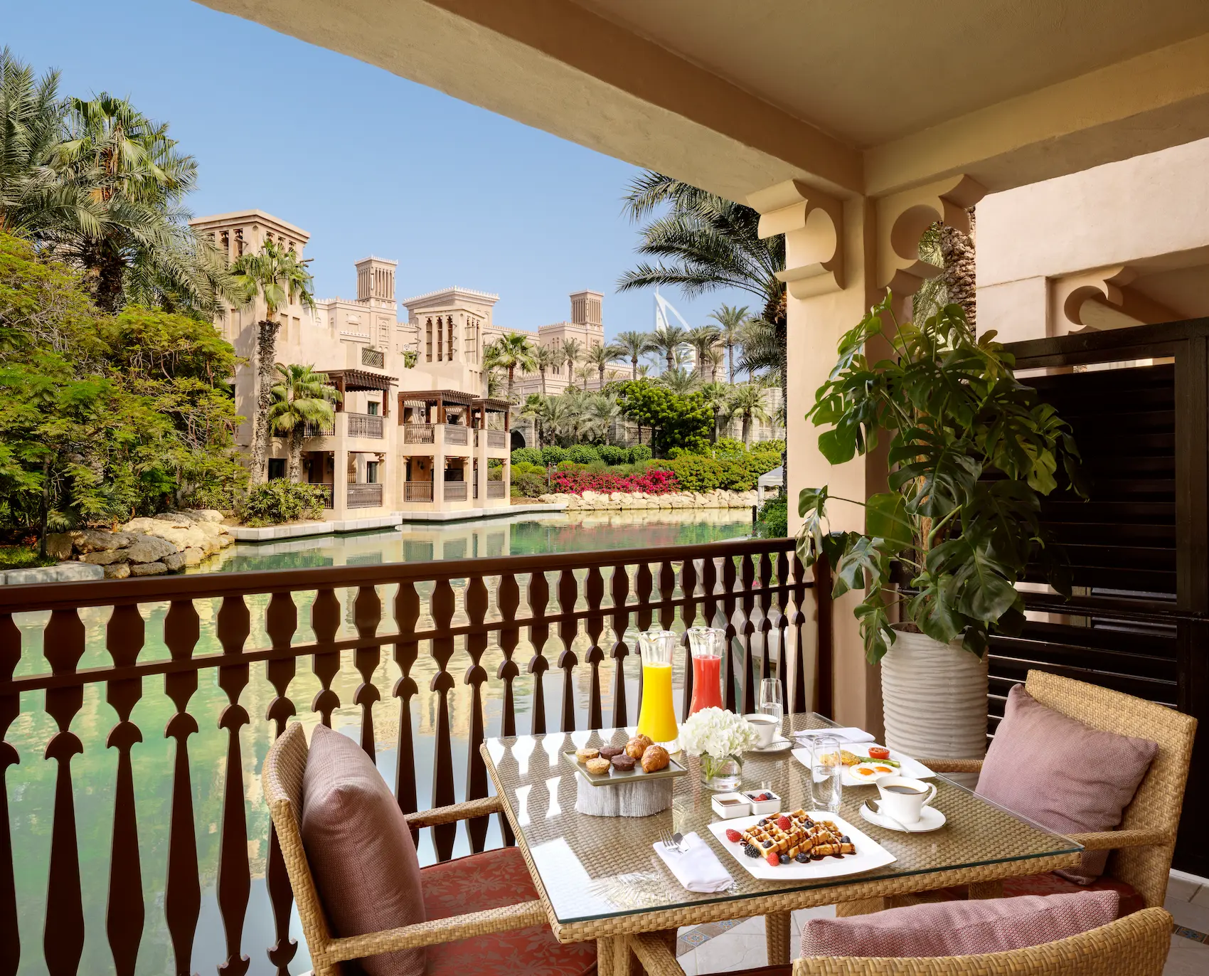 balcony of palm house lagoon room at jumeirah dar al masyaf overlooking the tropical gardens and lagoon
