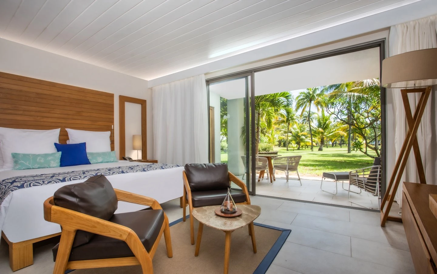 bedroom with terrace in a paradis bay view room at paradis mauritius