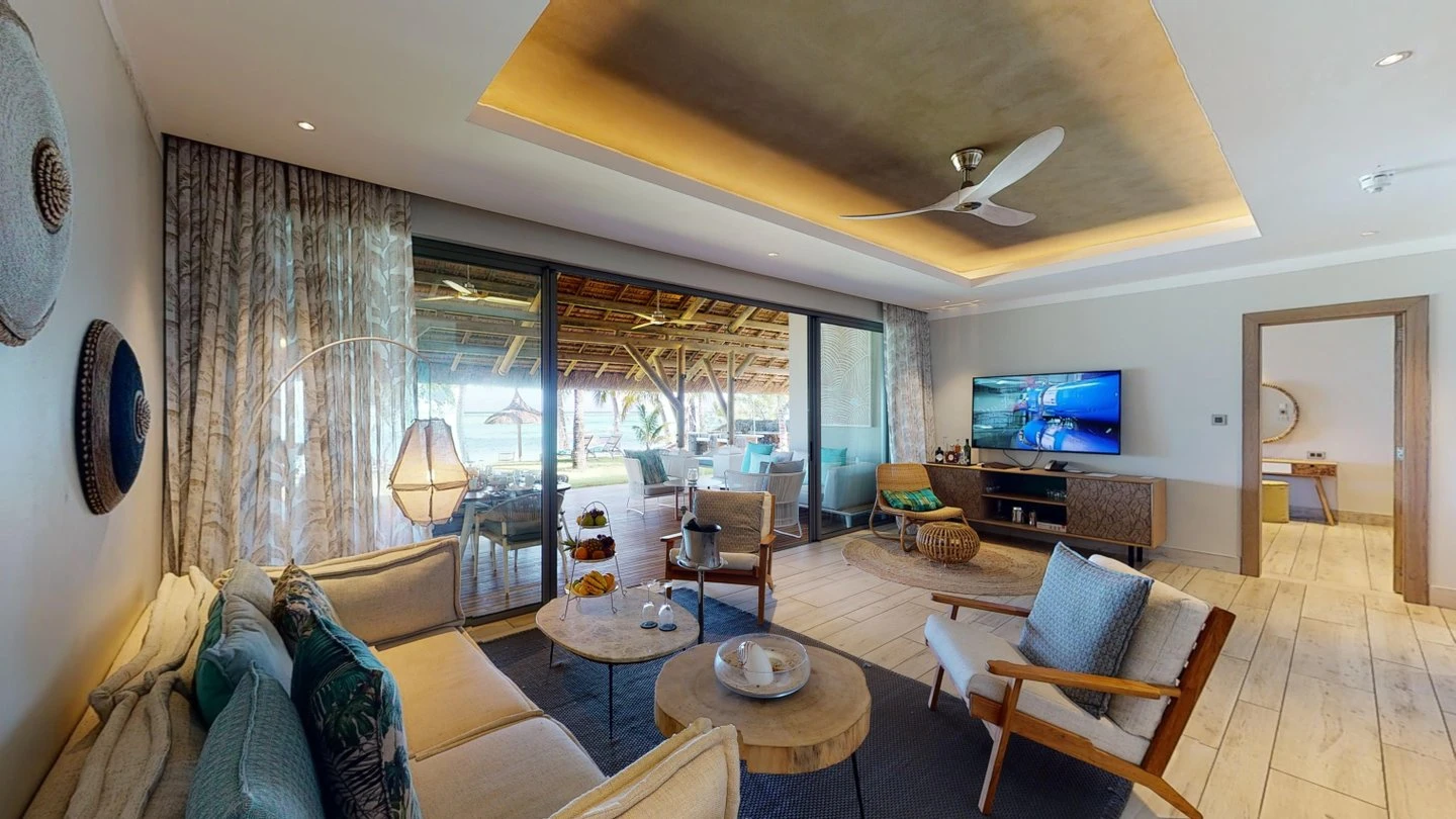 paradis paradis villa lounge with tv and beachfront view