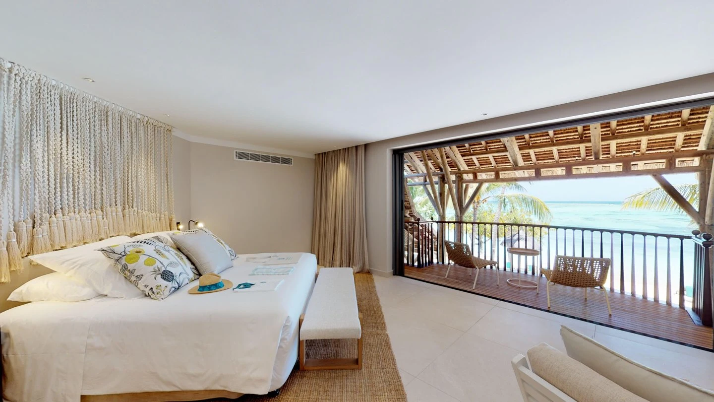 paradis presidential villa bedroom with balcony and beachfront view