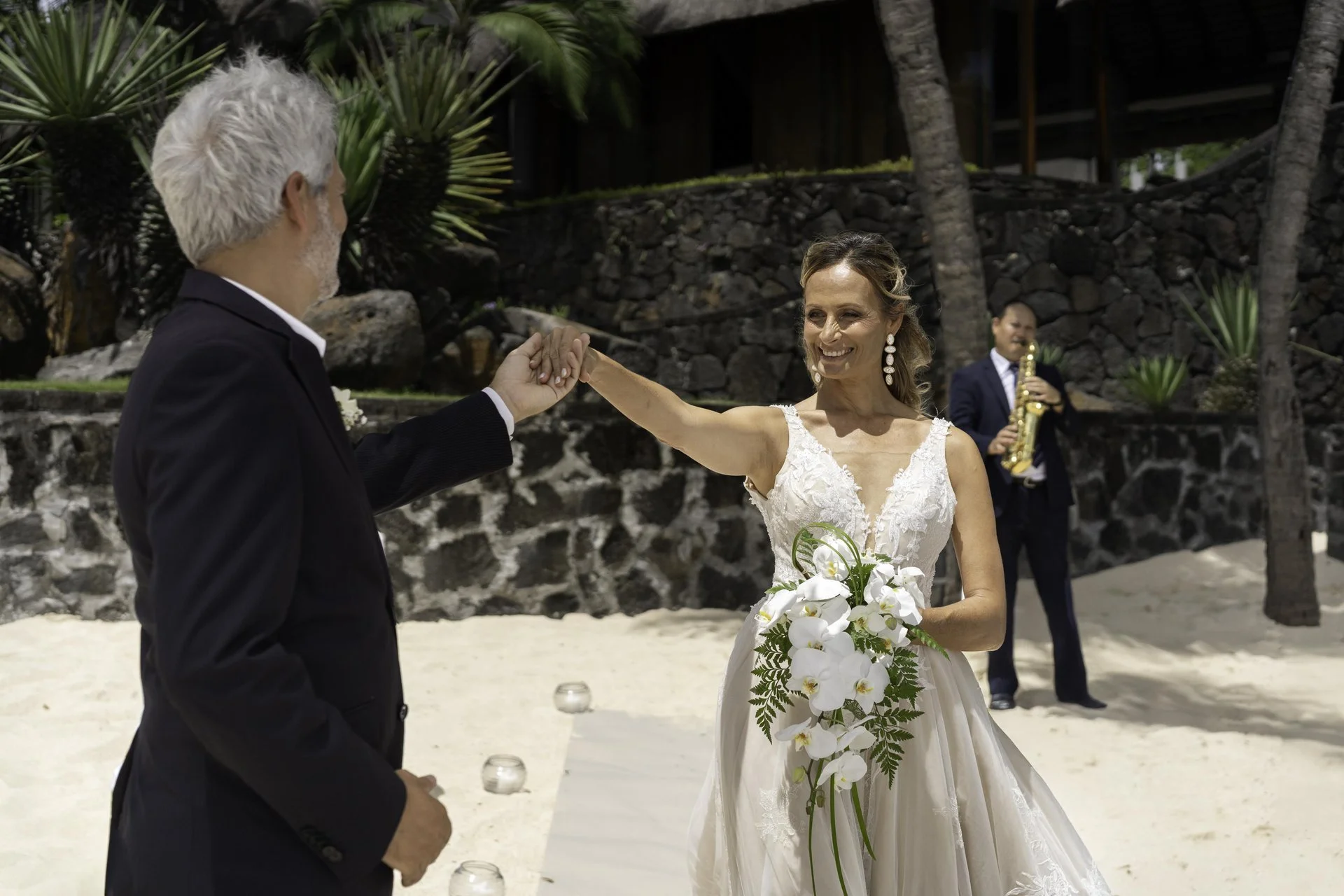 royal palm mauritius wedding couple posing on beachfront with tropical scenery